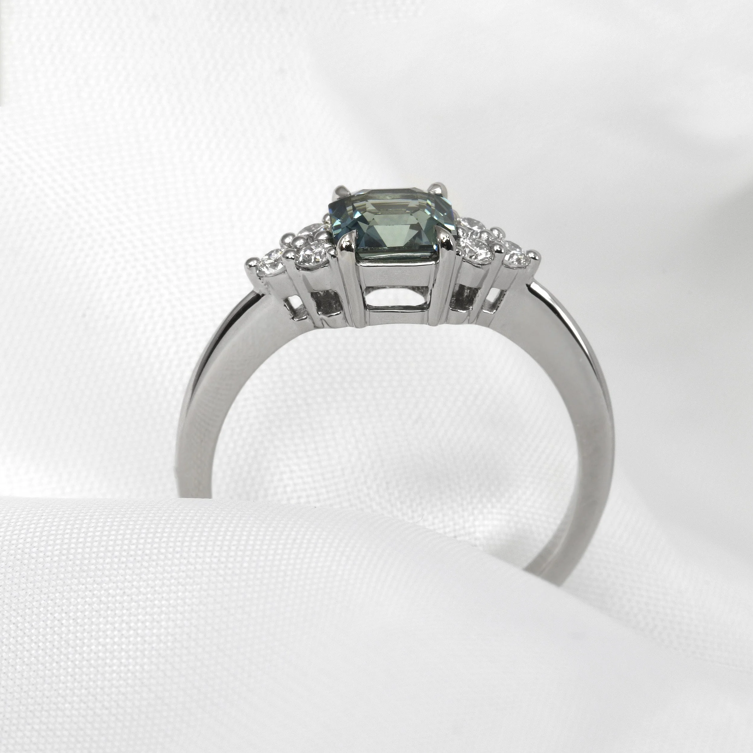 Teal Sapphire Ring with Diamond Trefoil in Platinum