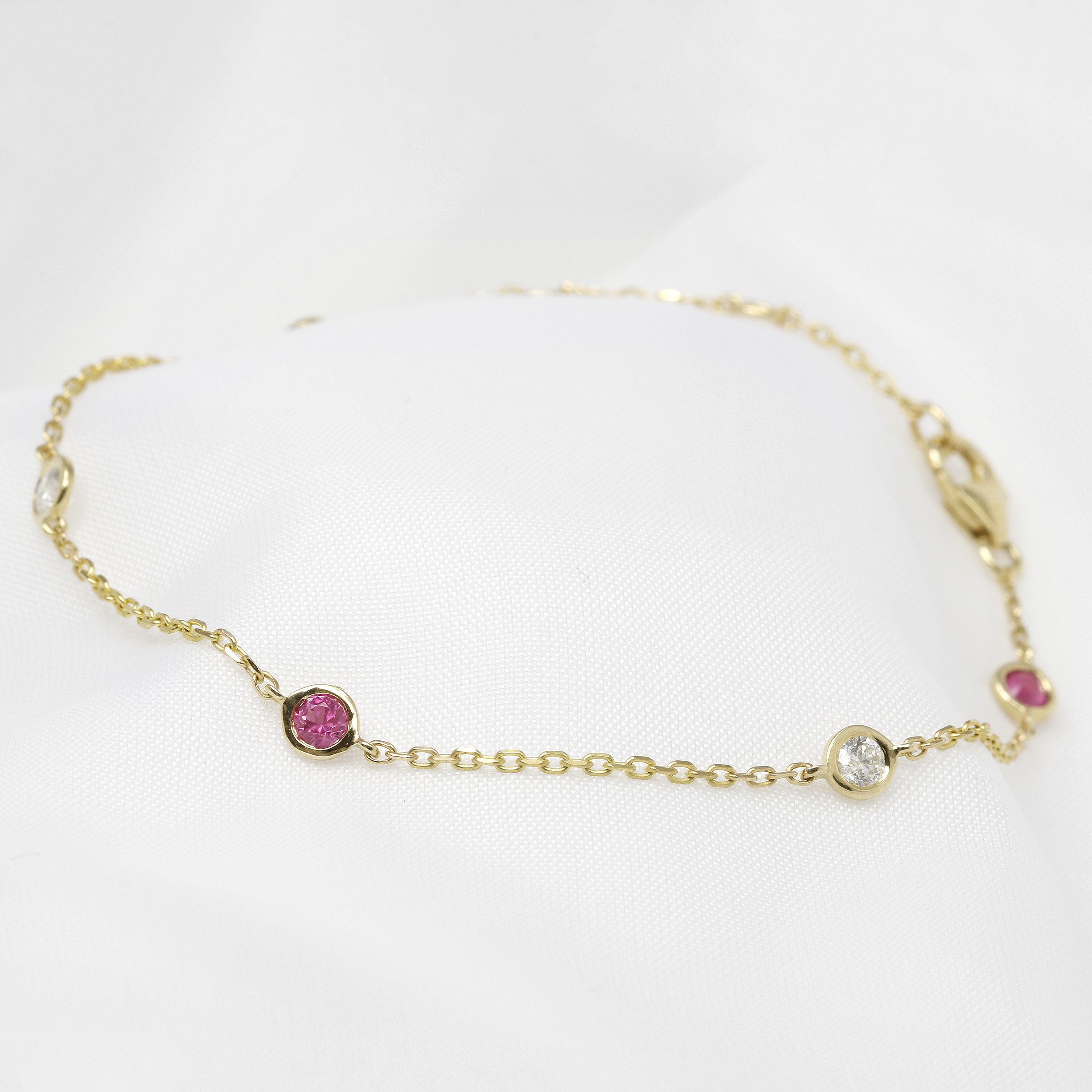  Pink Sapphire and Diamond Station Bracelet in 9ct Yellow Gold £595.00 