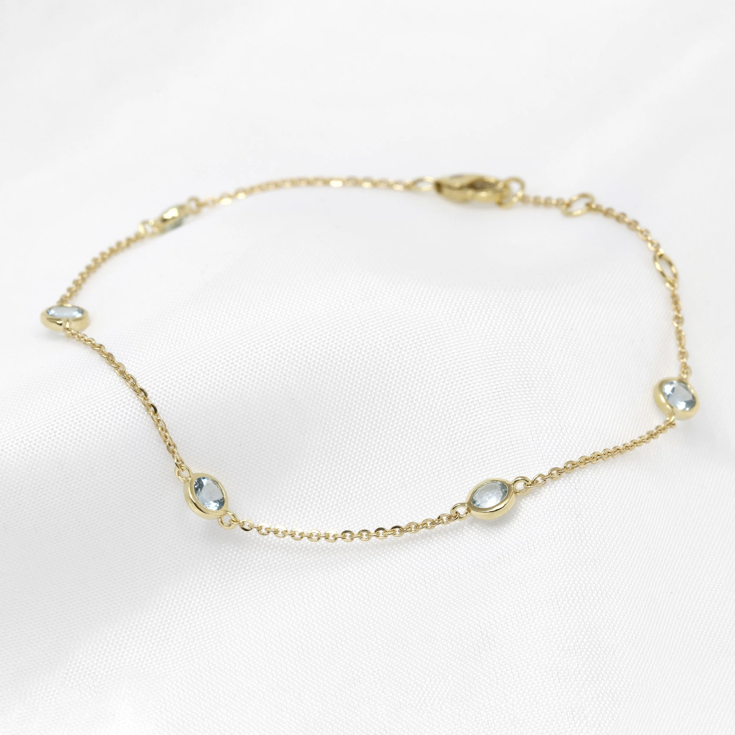  Aquamarine Station Bracelet in Yellow Gold £320.00 