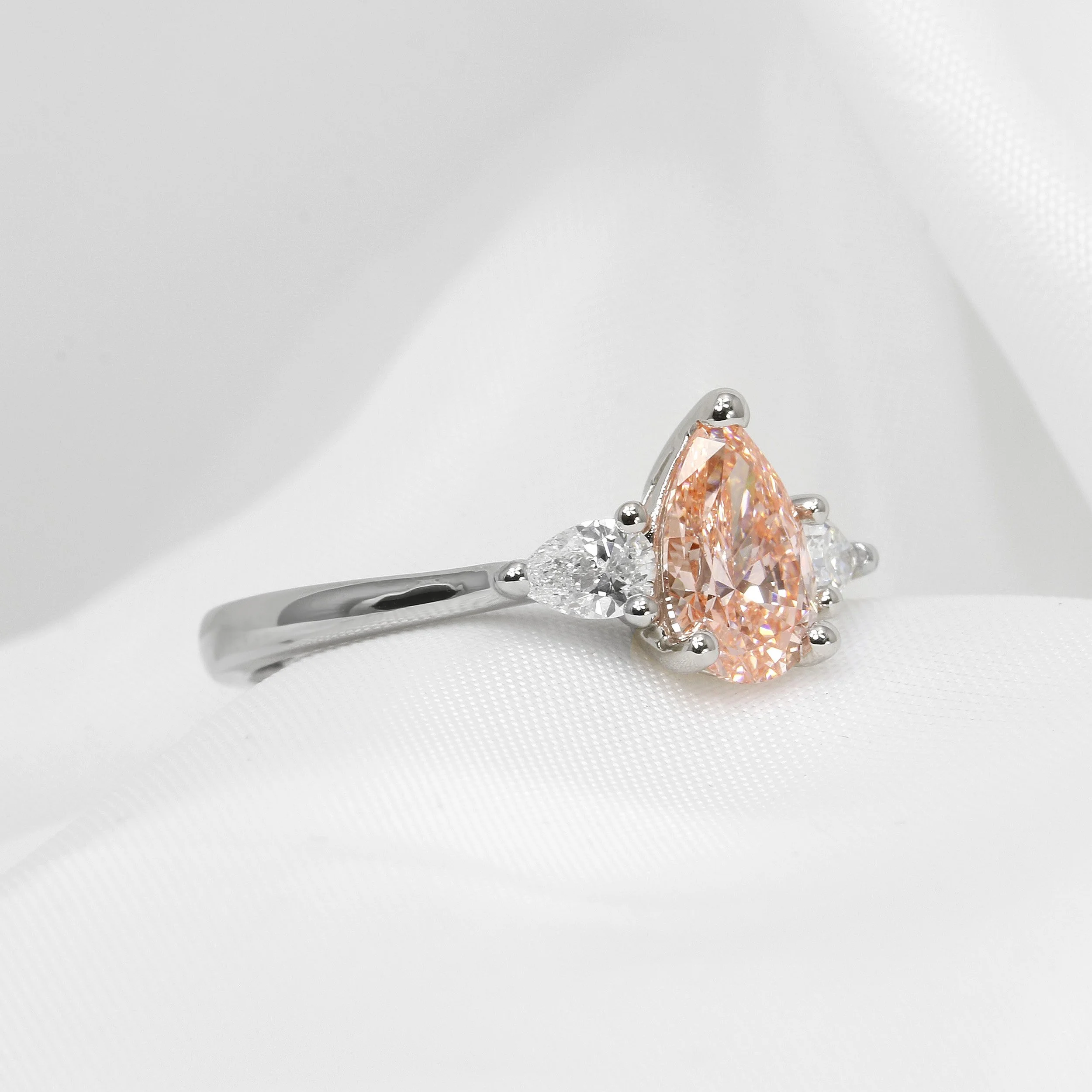 Lab Created Pink Pear Shape Diamond Three Stone Ring