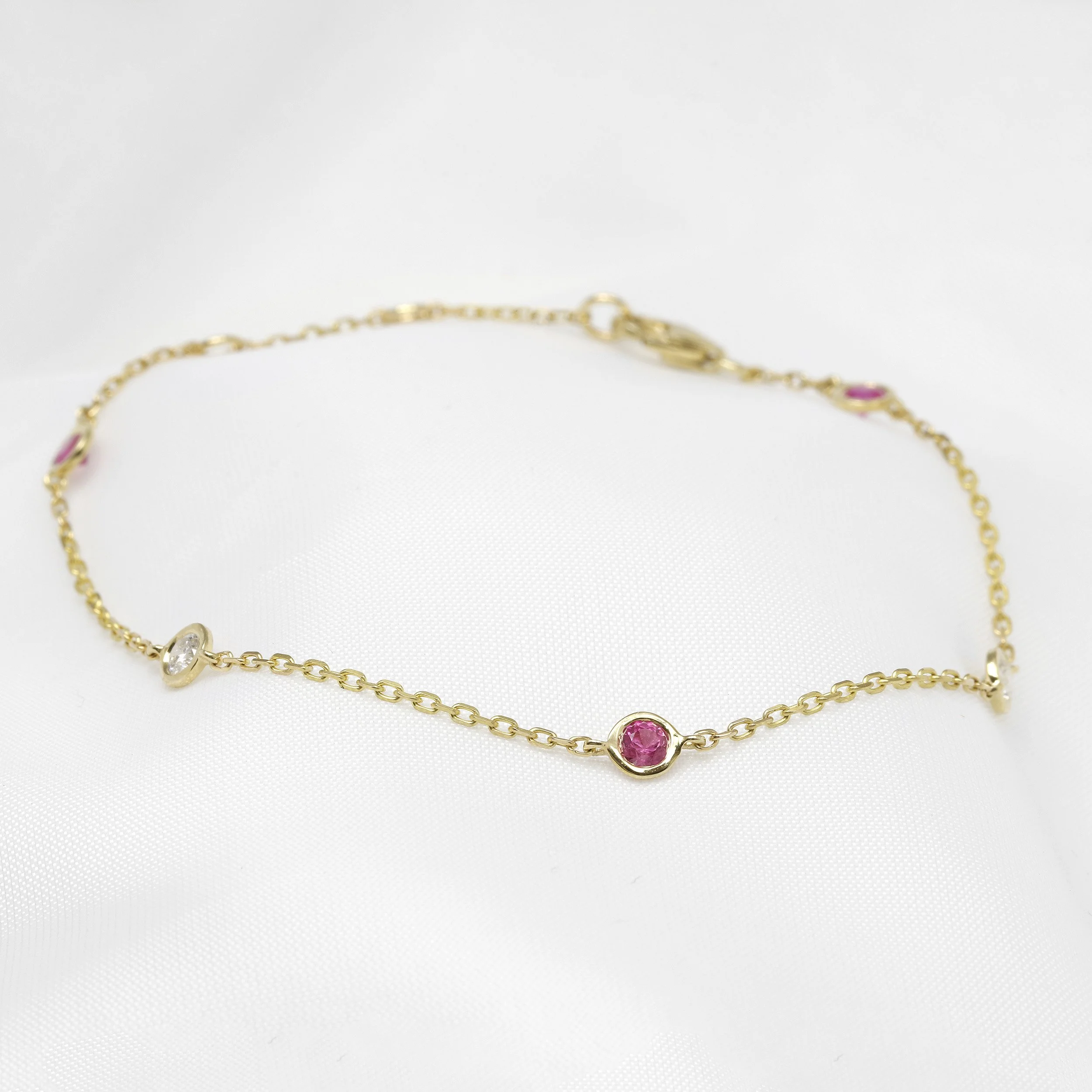  Pink Sapphire and Diamond Station Bracelet in 9ct Yellow Gold £595.00 