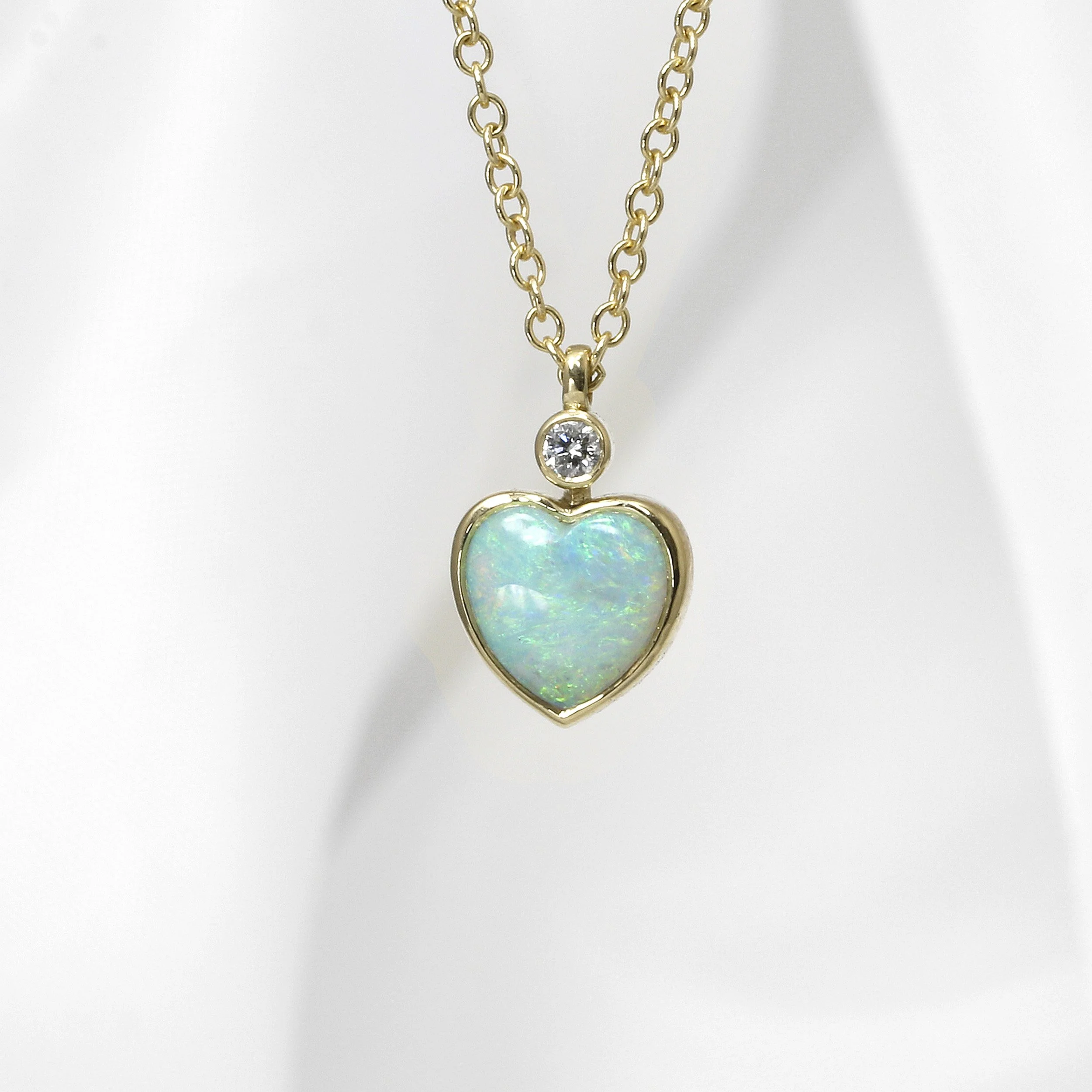 Heart Shaped Opal and Diamond Pendant in Yellow Gold