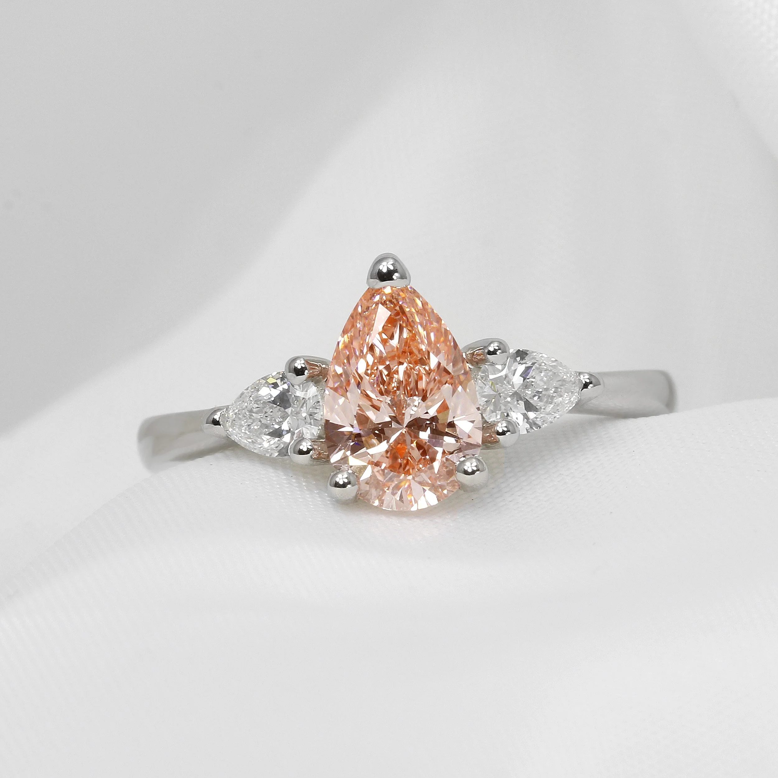 Lab Created Pink Pear Shape Diamond Three Stone Ring