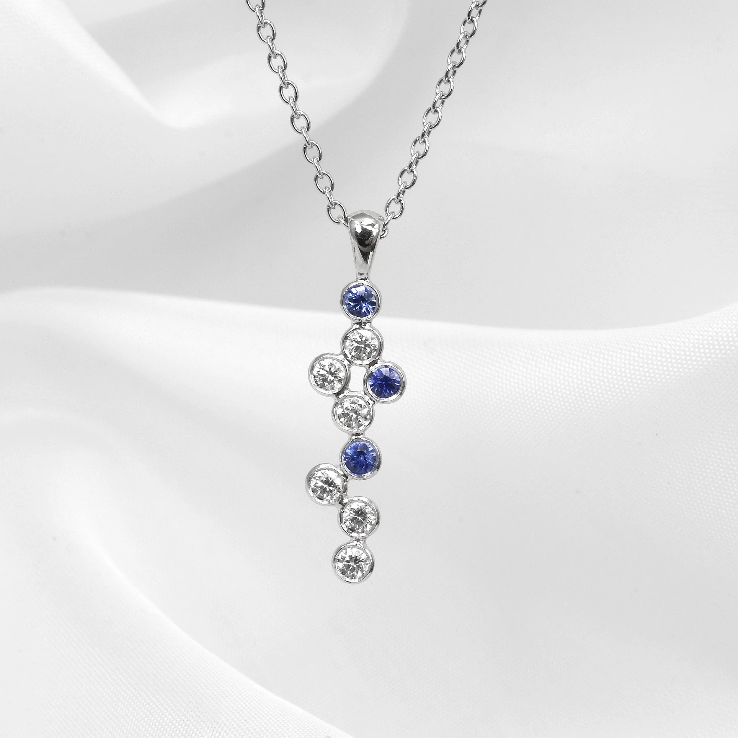 Sapphire and Diamond Drop Pendant in Platinum and White Gold