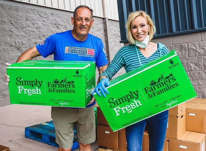 Paula White-Cain volunteering with Farmers to Families Initiative
