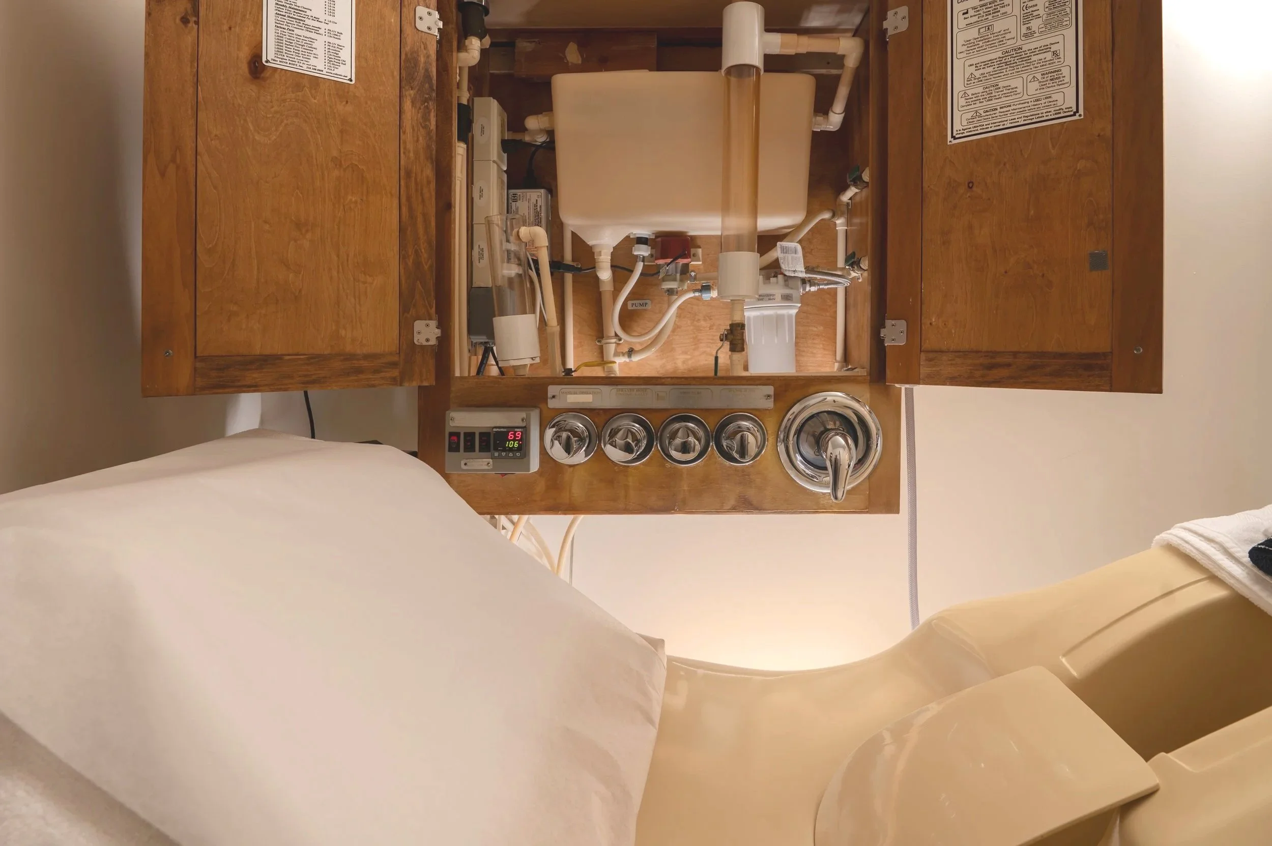 A close up of the LIBBE colonic system used at San Francisco Colonics, demonstrating the internal controls and flow mechanisms.
