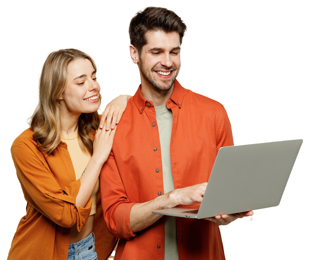 A young man and woman smiling and looking at a laptop screen, with the woman resting her hand on the man's shoulder.