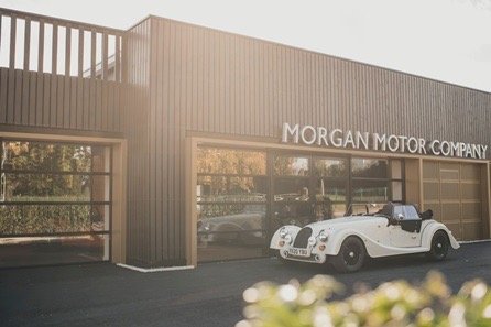 Vintage car parked in front of Morgan Motor Company building