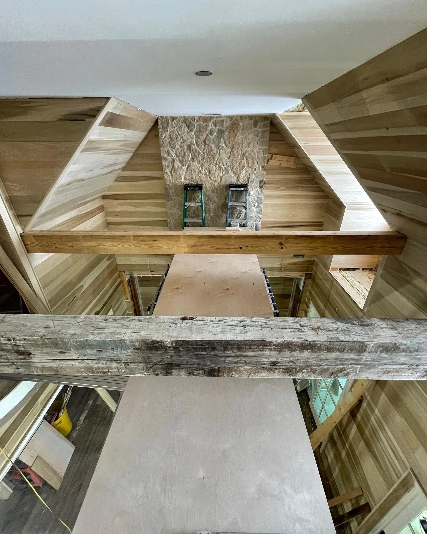 The view from the top! 

This remodel on Brays island looks amazing. These beams were wrapped with 100 year old reclaimed heart pine from a dairy barn up north. The walls are 1x8 poplar T&amp;G. I wish we had a picture of the scribes against that sto