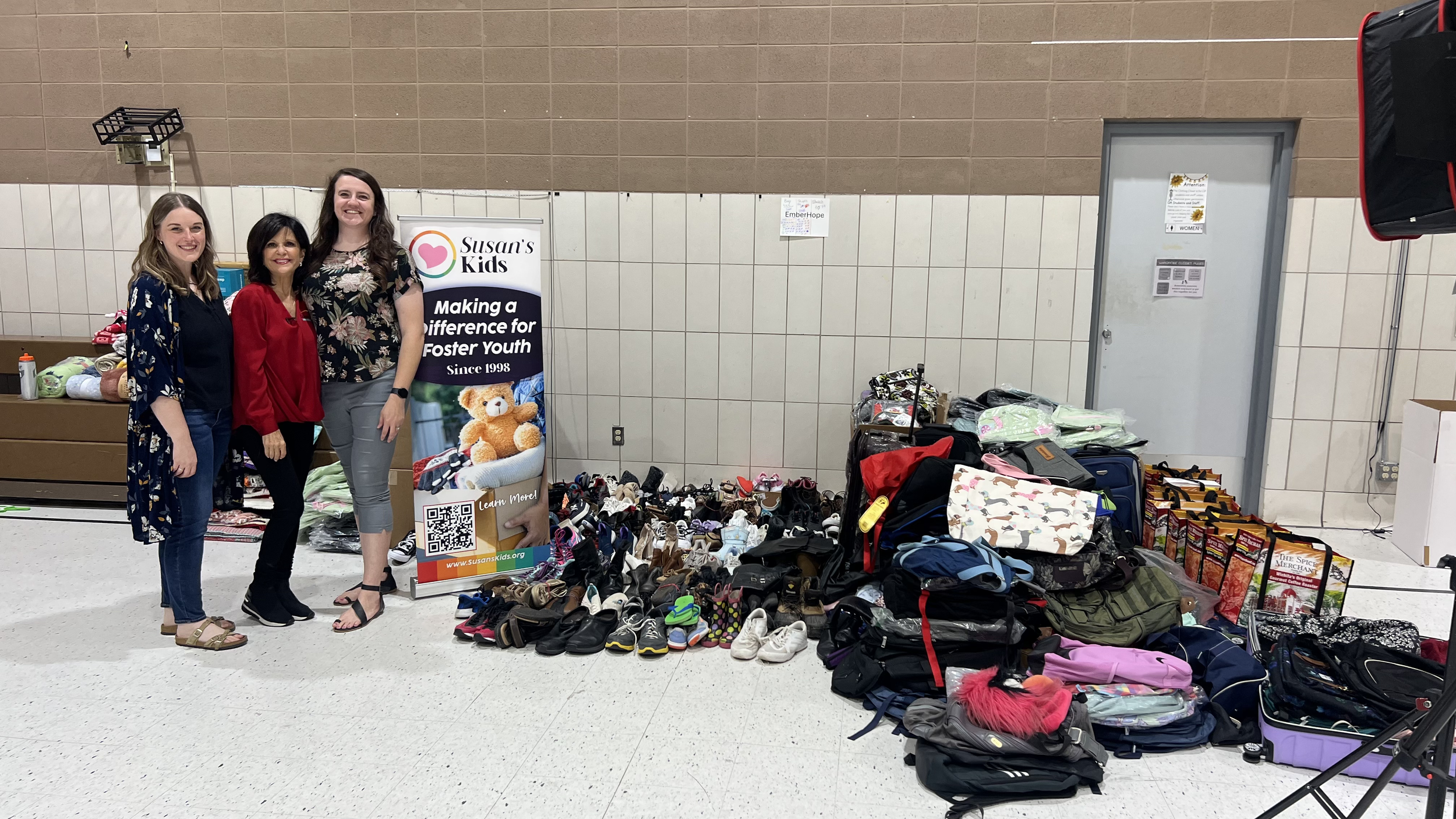 Britt English &amp; Autumn Huerter alongside Susan with EmberHope's distributed donations