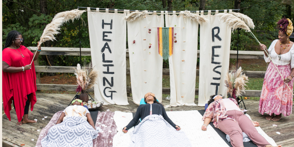 Black women resting in nature to calm their nervous system