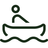 A simple line drawing of a person in a canoe on water.