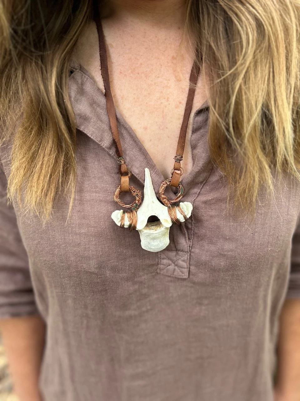 Sarah West artist bear vertebra necklace.jpeg