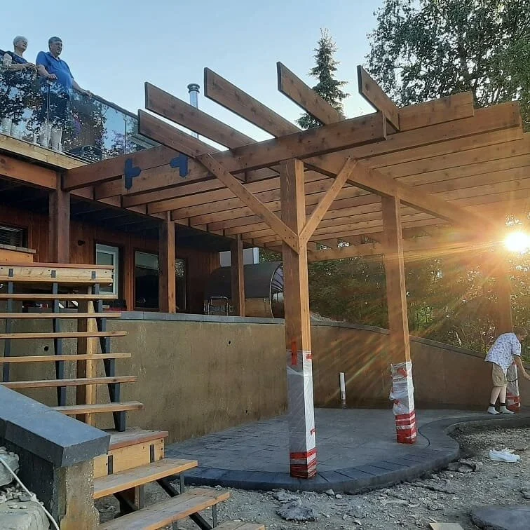 Custom Cedar Pergola, cedar stairs, glass railing, stamped dyed concrete pad and dyed structural Retaining wall. Norris Beach #pigeonlake #stamped concrete  #retainingwalls #pigeonlakedecks