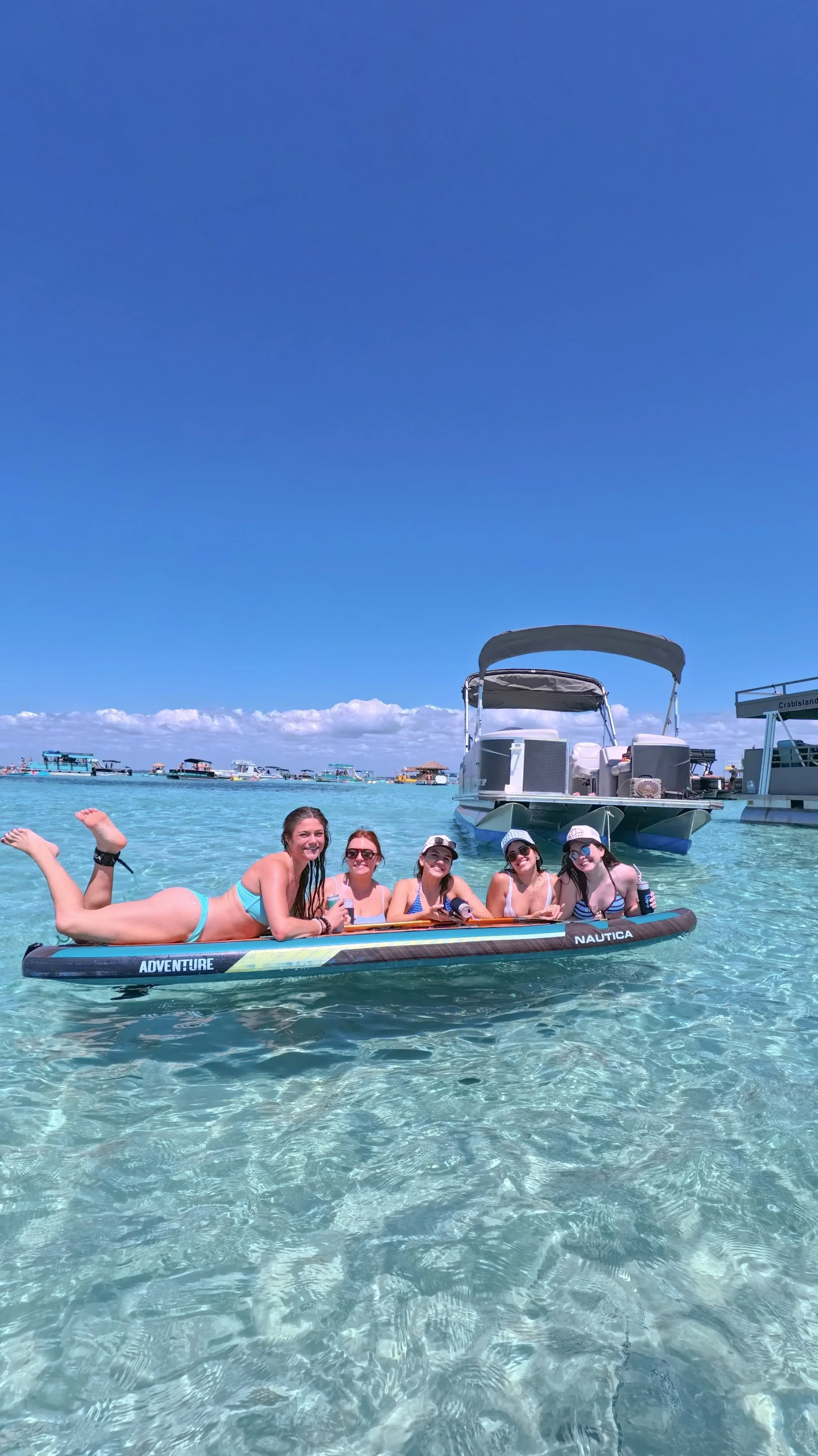 Pontoon girls on paddleboard.JPG
