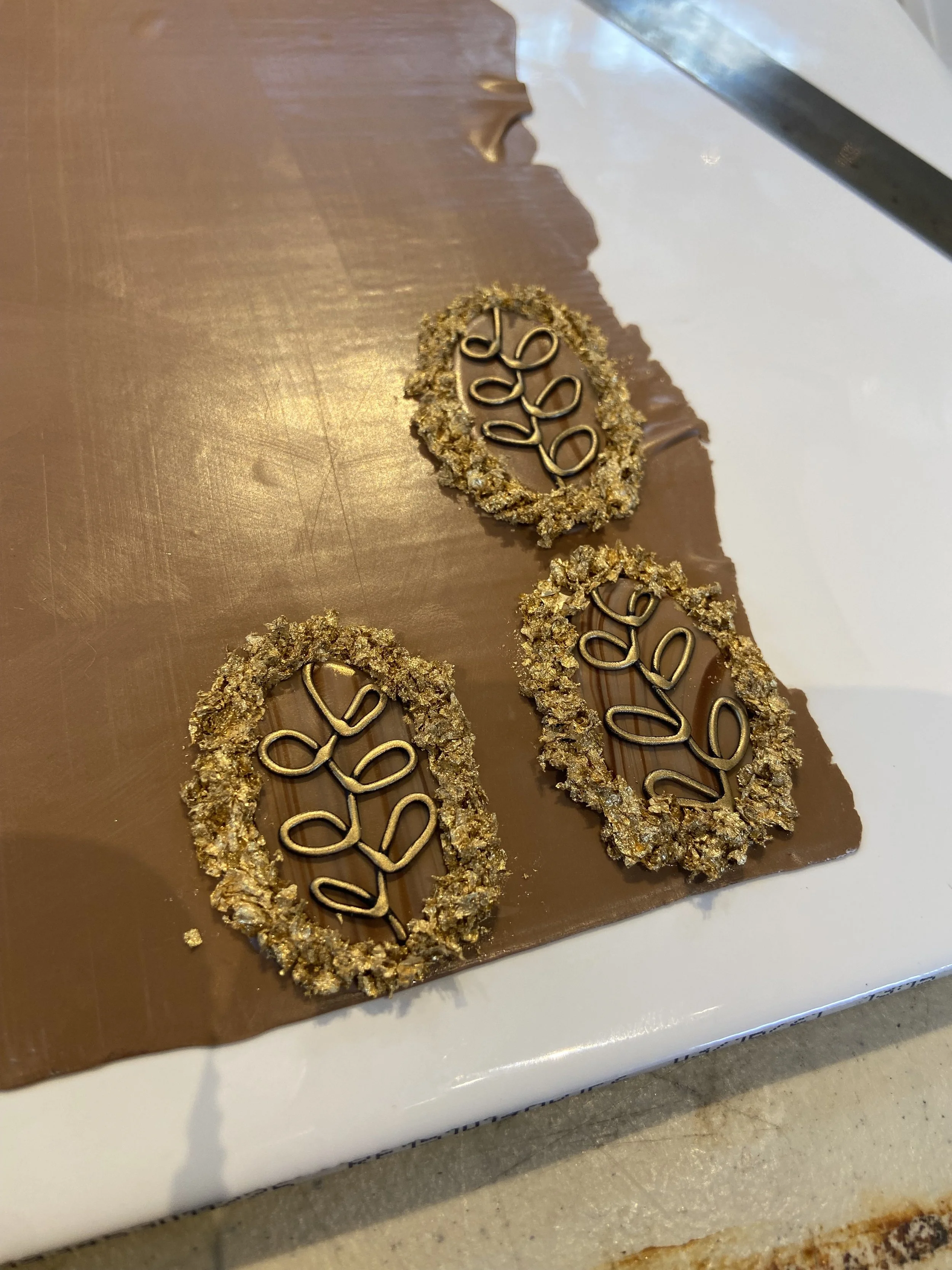 Making the frames out of gold leaf and liquid polymer clay