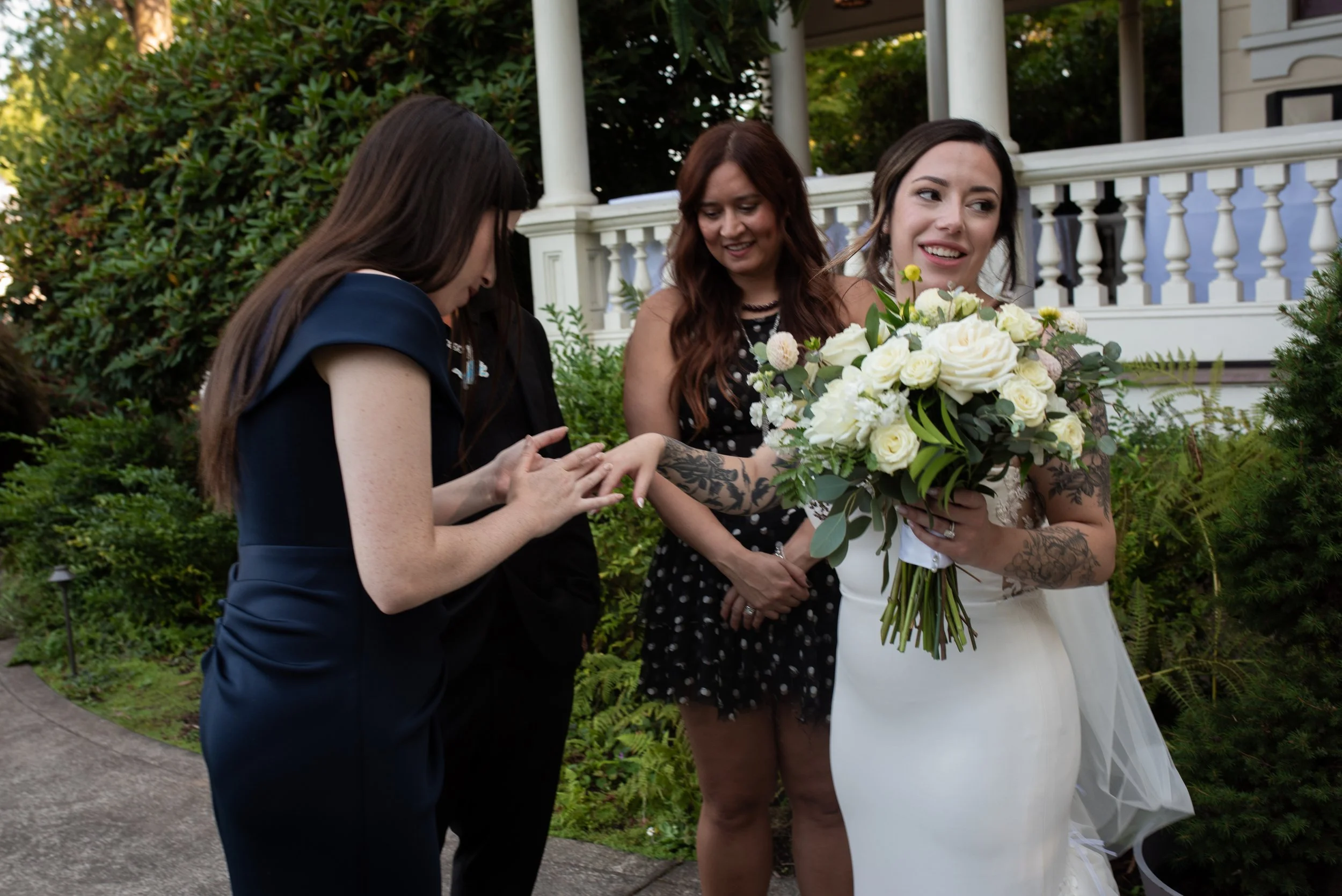 Bride showing off her ring during a wedding at the Victorian Belle Mansion in Portland OR. Documentary style wedding photographer. 