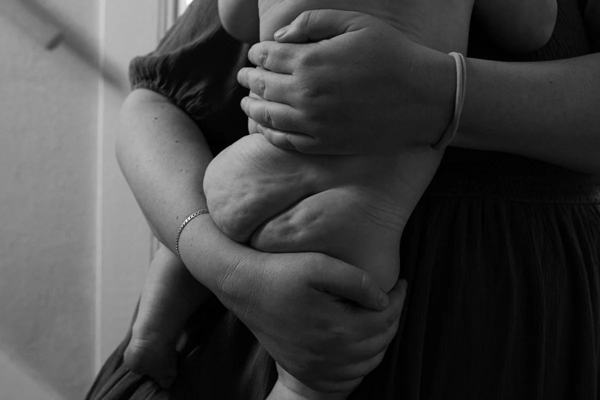 Black and white image of parent and baby in Portland, Oregon