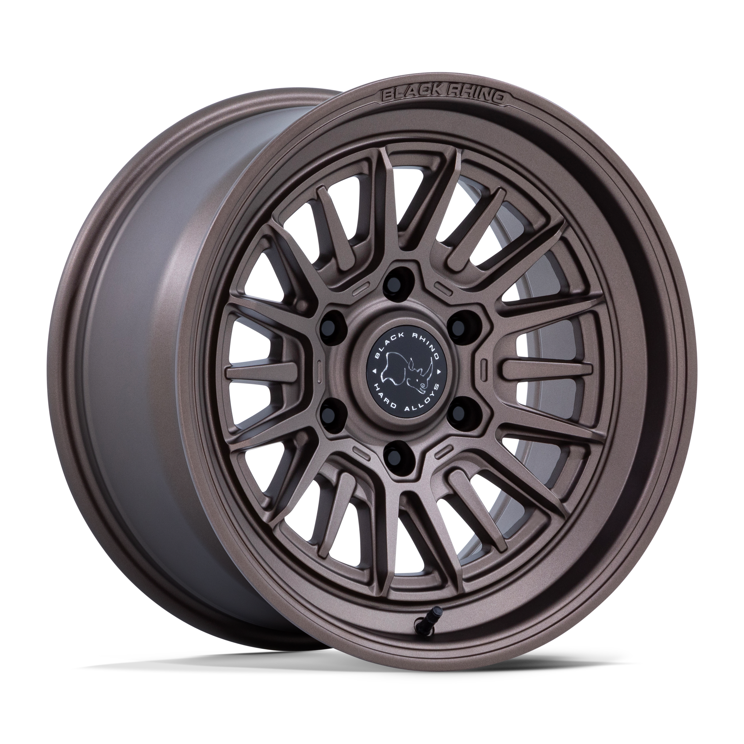 A close-up image of a gray alloy car wheel with a black center cap, labeled 'Black Rhino' and 'Hard Alloys,' showing detailed spokes and lug nut holes.