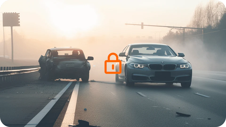 A two-car accident on a highway with one car crashed into the guardrail and the other stopped in the middle of the road, with fog and early morning light.
