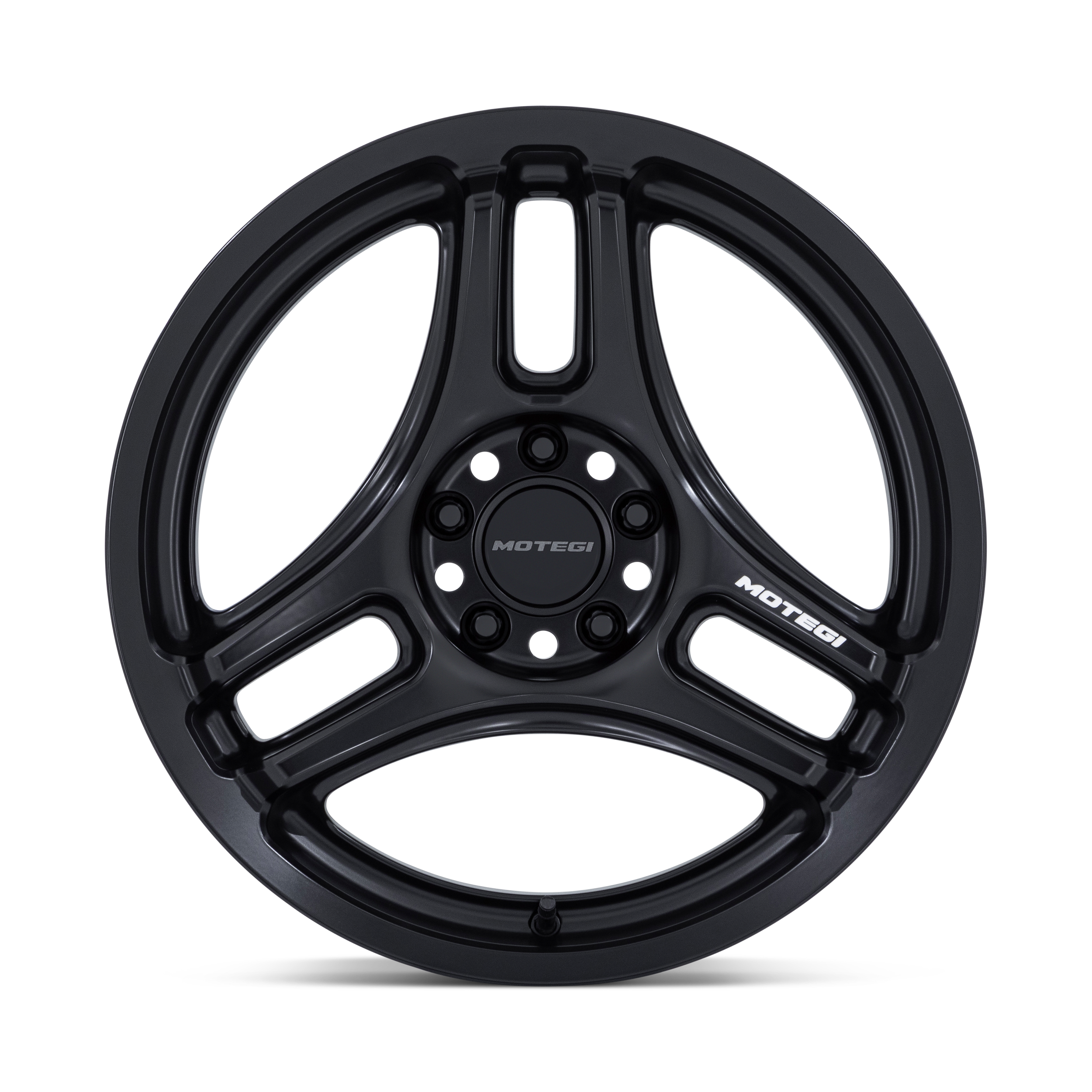 Black Motegi Racing aluminum wheel rim with the brand name on three spokes, isolated on a gradient background.