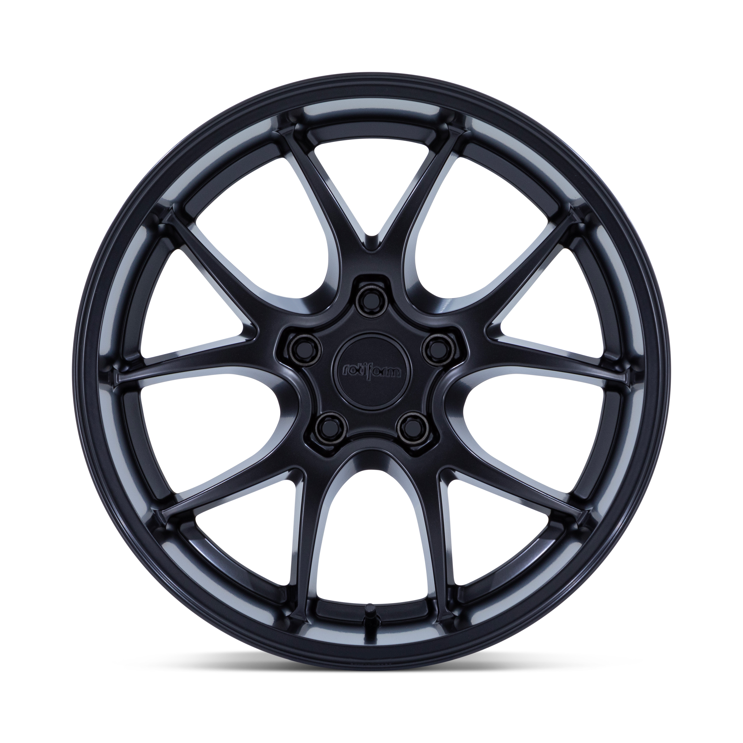 A black alloy car wheel with a multi-spoke design isolated on a black background.