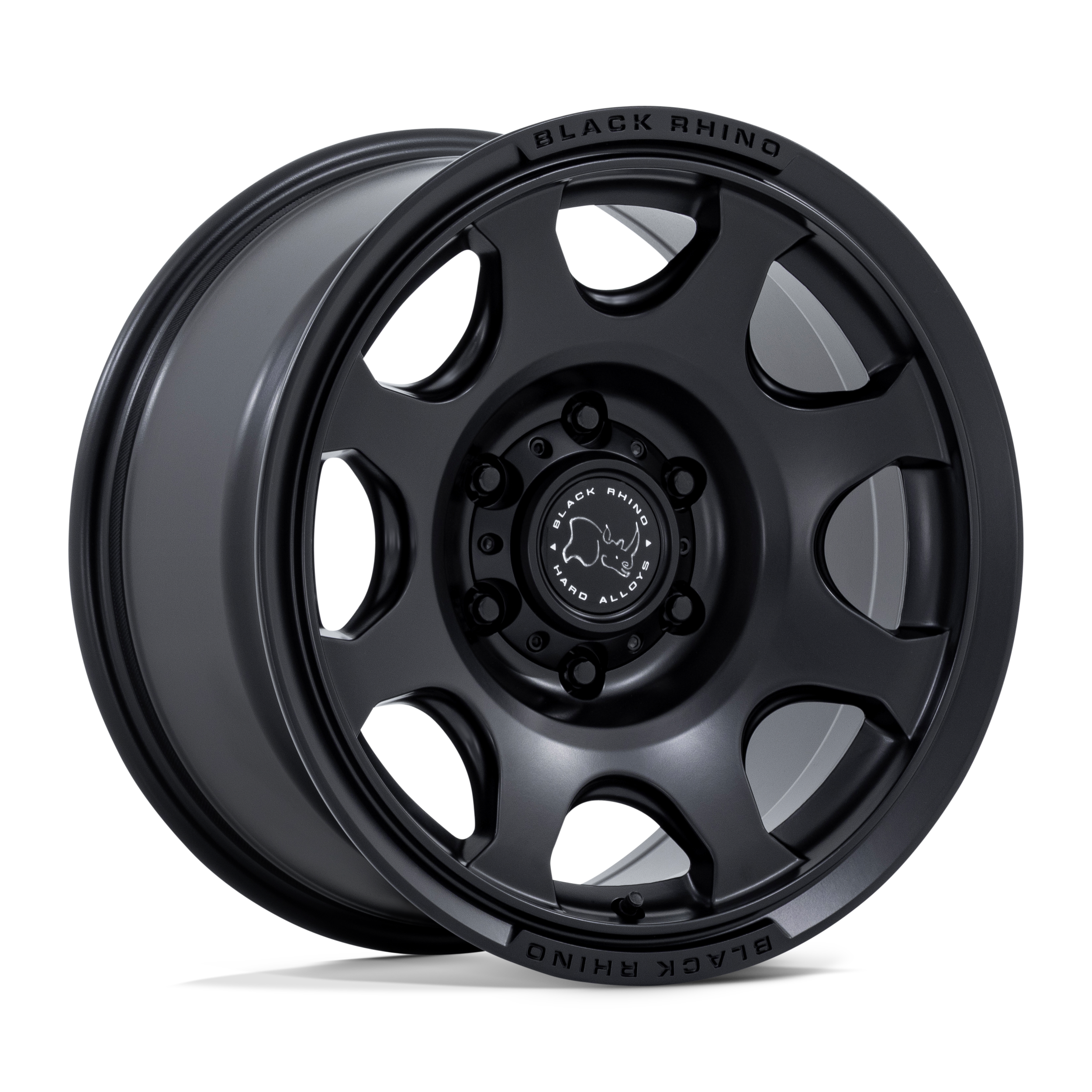 Close-up of a matte black off-road ready alloy wheel with a central hub bearing the Black Rhino logo and the words 'Black Rhino Hard Alloys' on the center cap, designed for rugged vehicle use.
