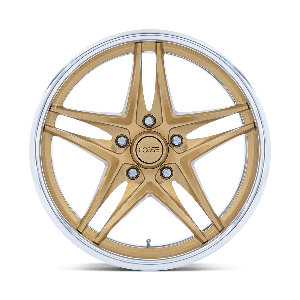 Gold and silver alloy wheel rim isolated on black background.