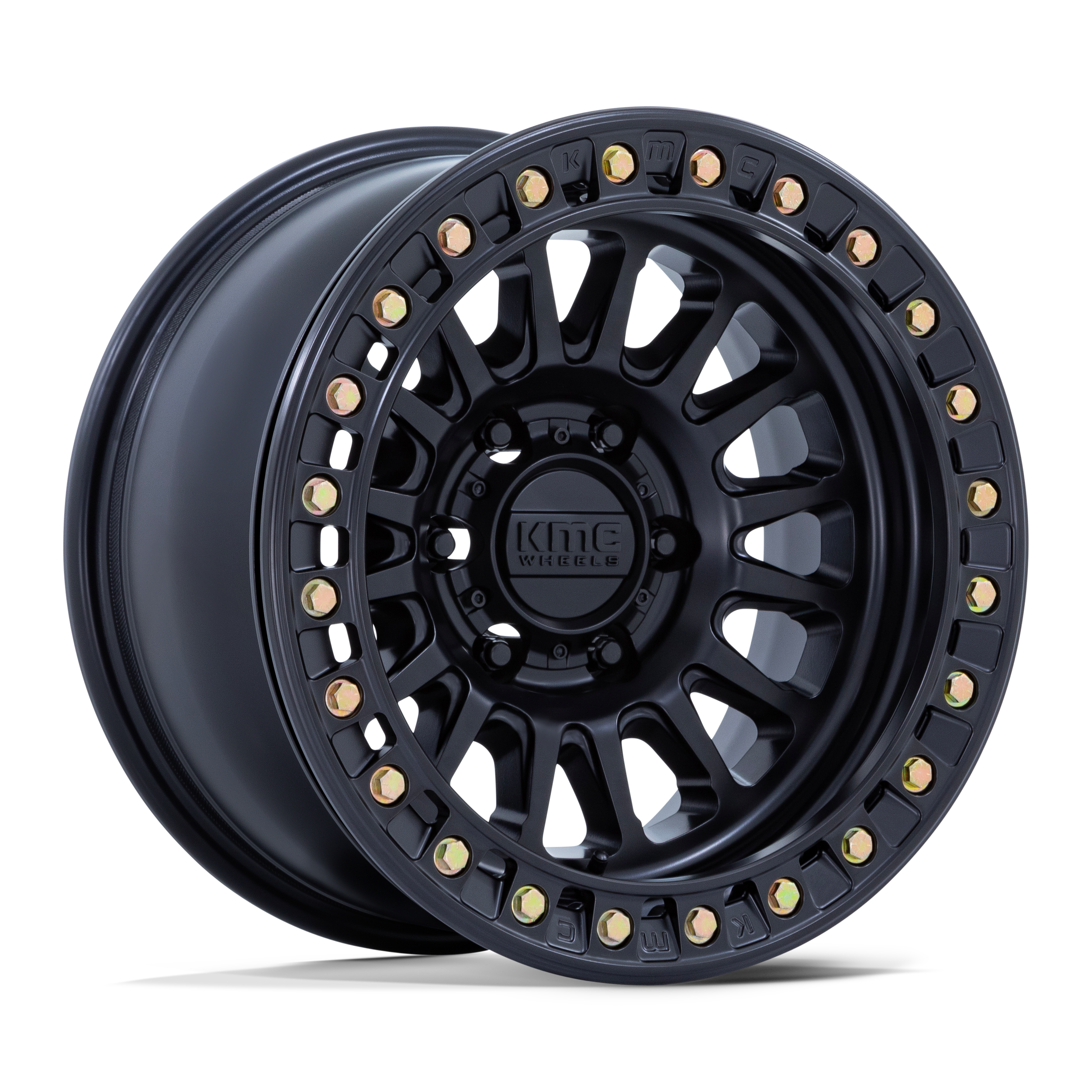 A black alloy wheel with a multi-spoke design, gold-colored bolts around the rim, and a central hub with the logo 'KMC Wheels'.