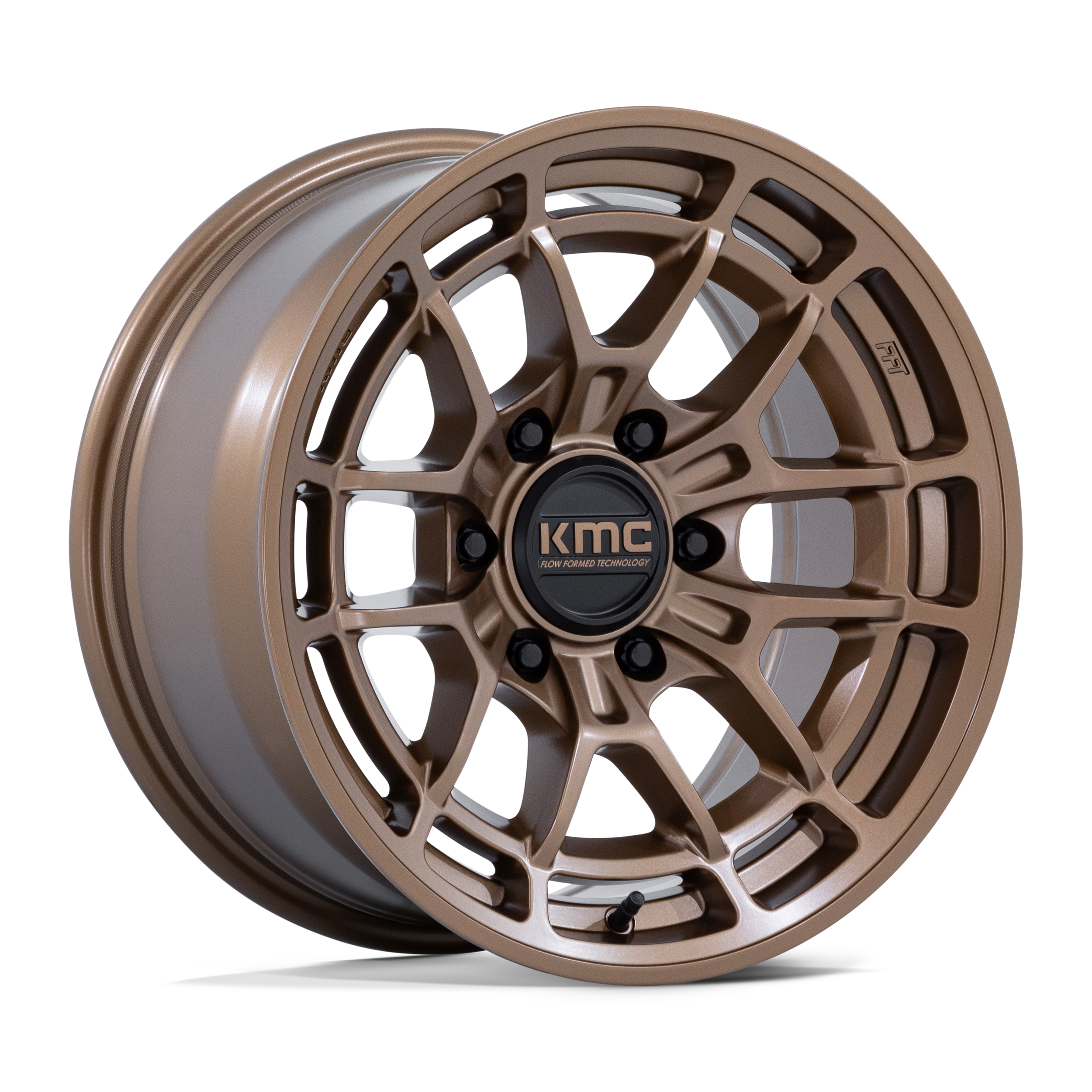 Bronze-colored KMC alloy wheel rim with intricate angular spoke design and black center cap with KMC logo.