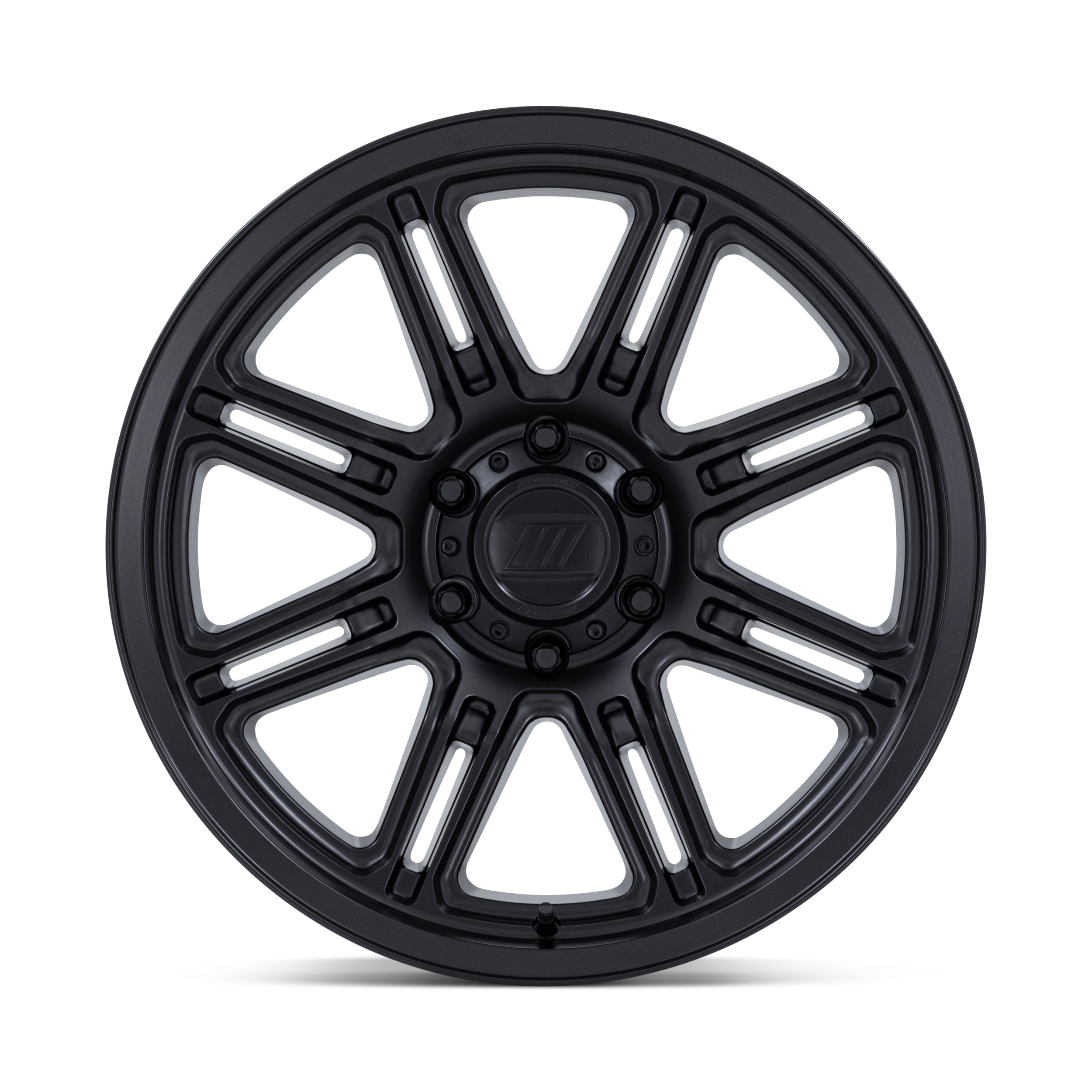 A black multi-spoke car wheel or rim with a central hub and lug nut holes, isolated on a black background.