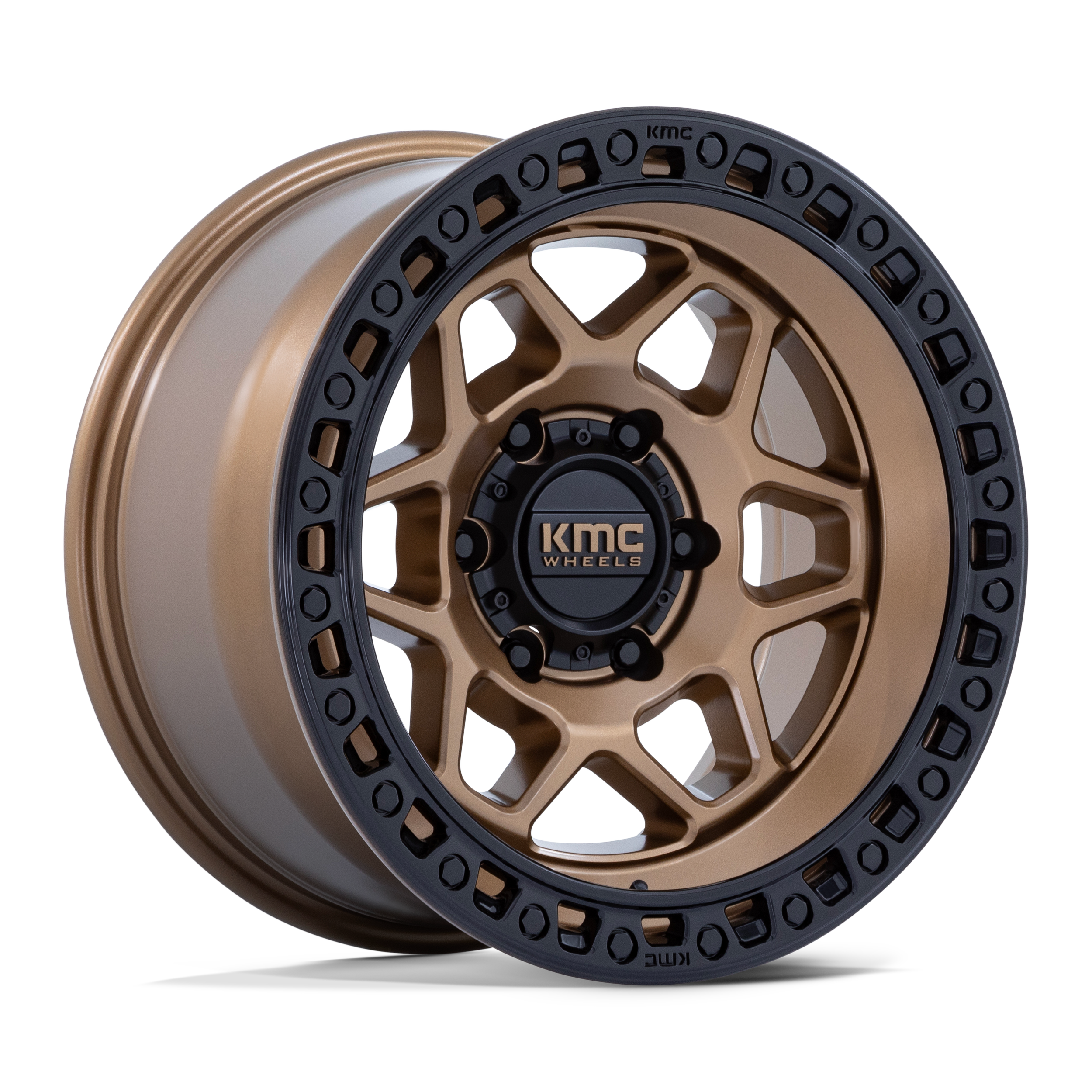 Gold-colored KMC Wheels alloy wheel with black accents and the KMC logo in the center.