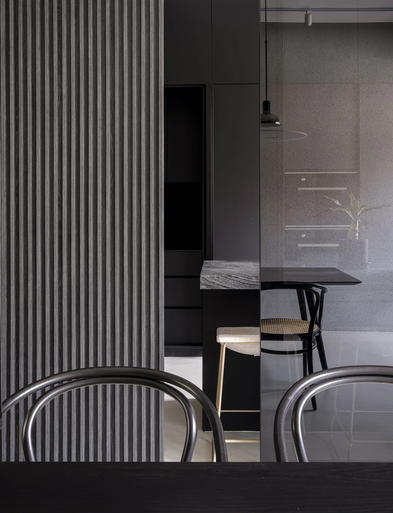 fluted panel wall detail, chairs and bar counter stone top