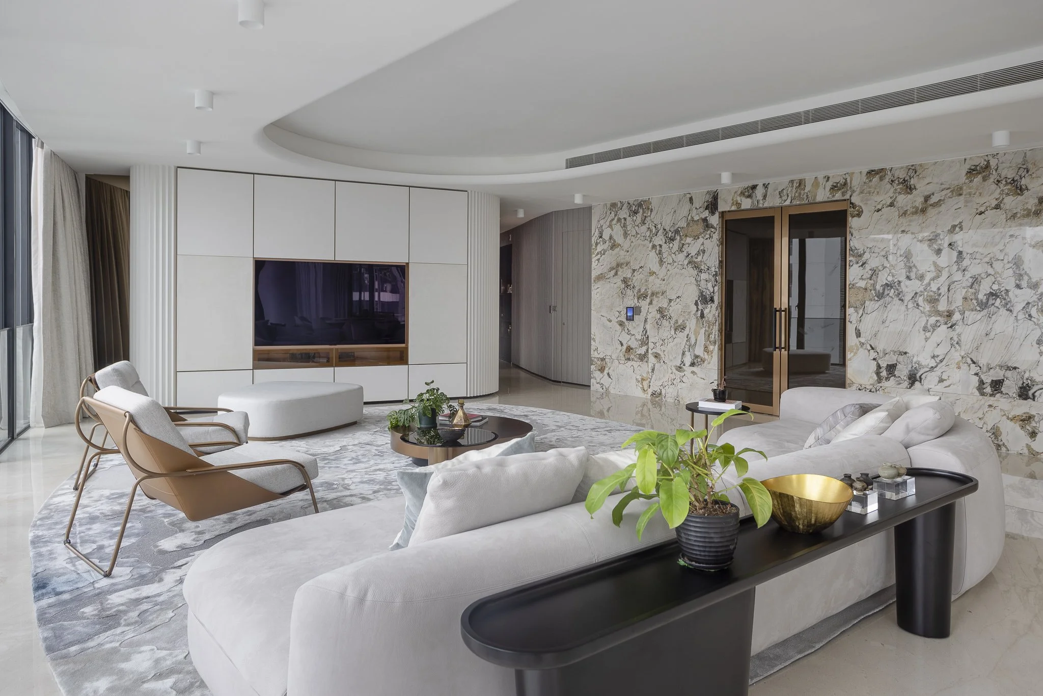 Interior design. Sophisticated modern living room with muted tones and gold accents