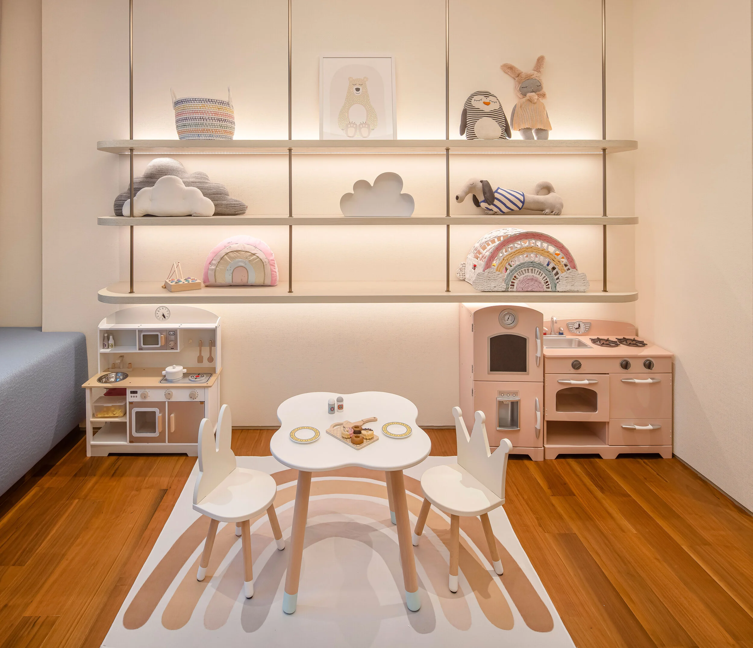 children's play area with toys, furniture and rug