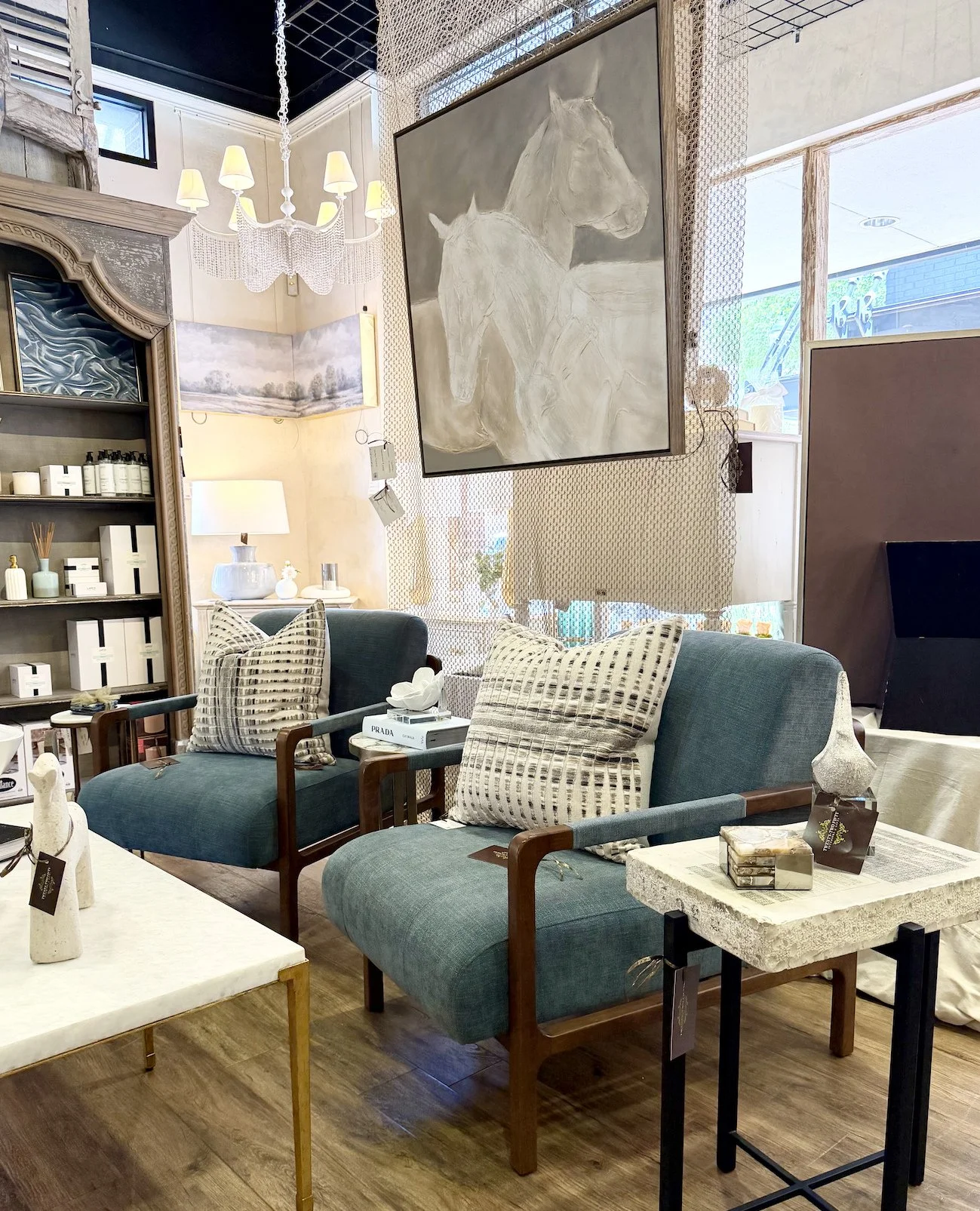 A beautifully layered space starts with pieces that speak to one another. 🤍 From the statement artwork and chandelier to the accent chairs, tables, pillows, and accessories, every detail in this vignette was thoughtfully curated to create a collecte