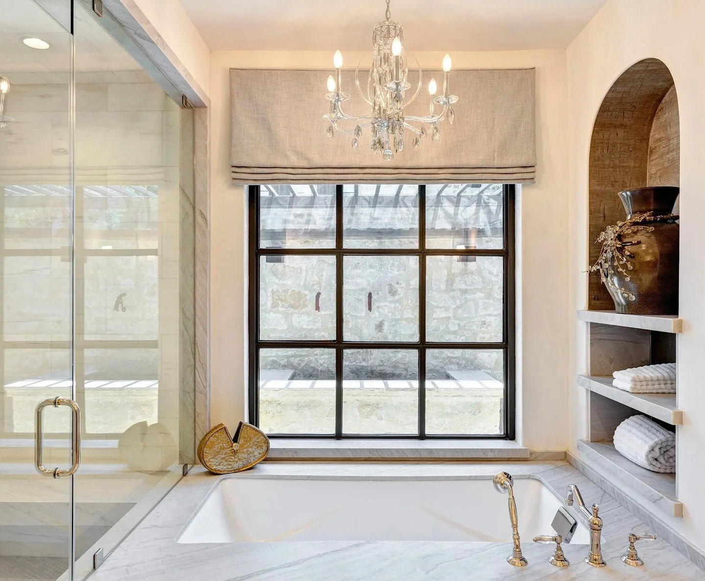 A Spa Retreat, Right at Home ✨⁠
⁠
This primary bathroom was designed to feel like a luxury escape. From the dual marble vanities and elegant polished nickel fixtures to the custom cabinetry, statement mirrors, and soft architectural arches, every det