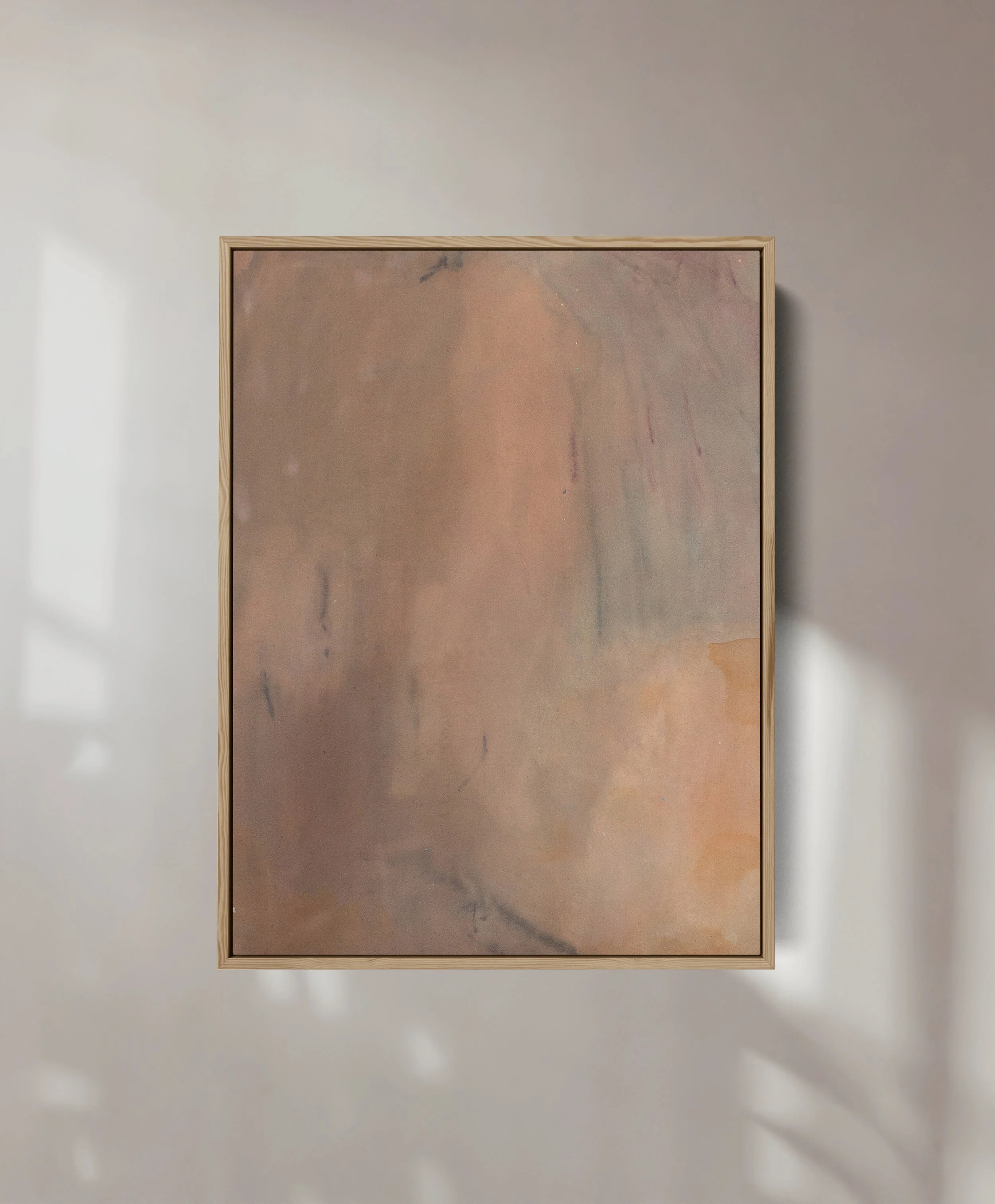 A framed abstract artwork with muted earthy tones hangs on a light-colored wall.