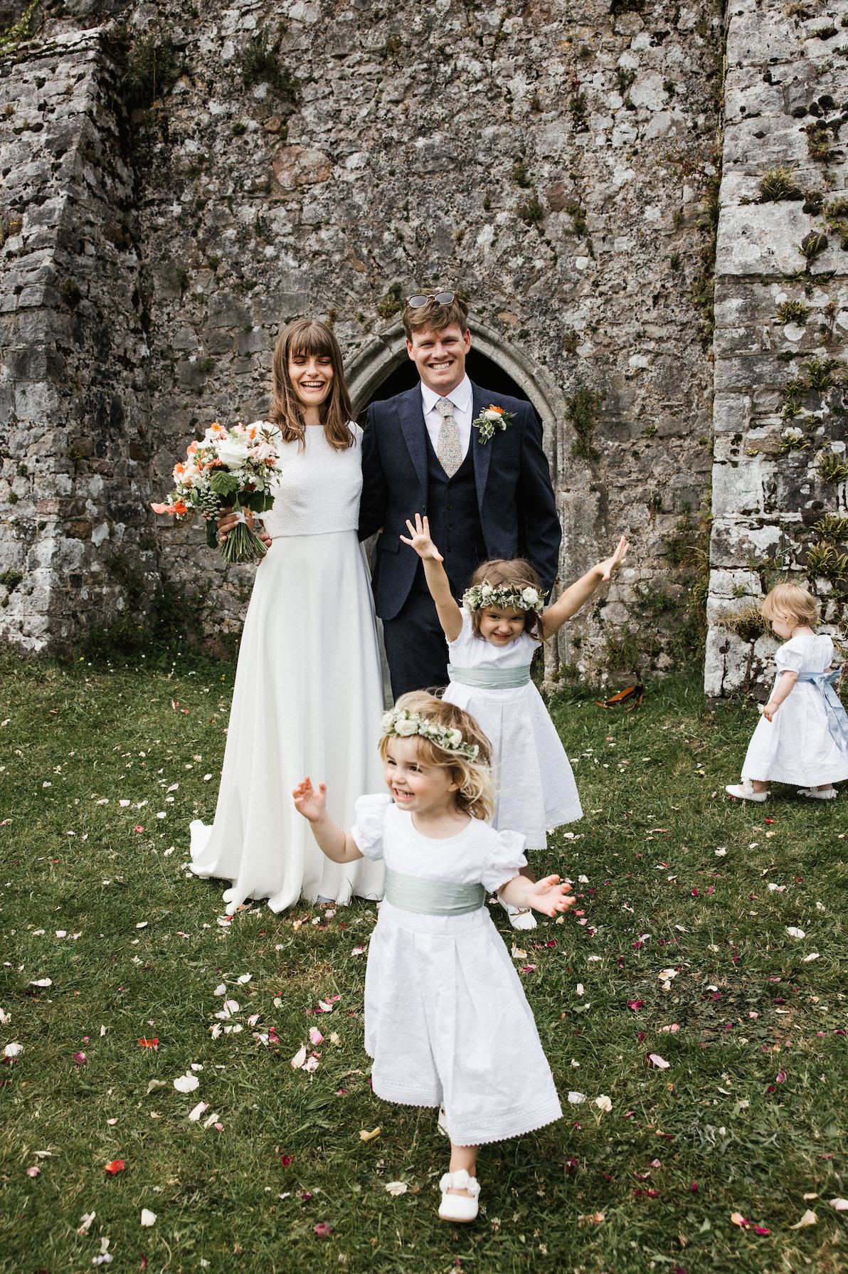 Bridal party outside Penrice castle estate church, Gower, Swansea