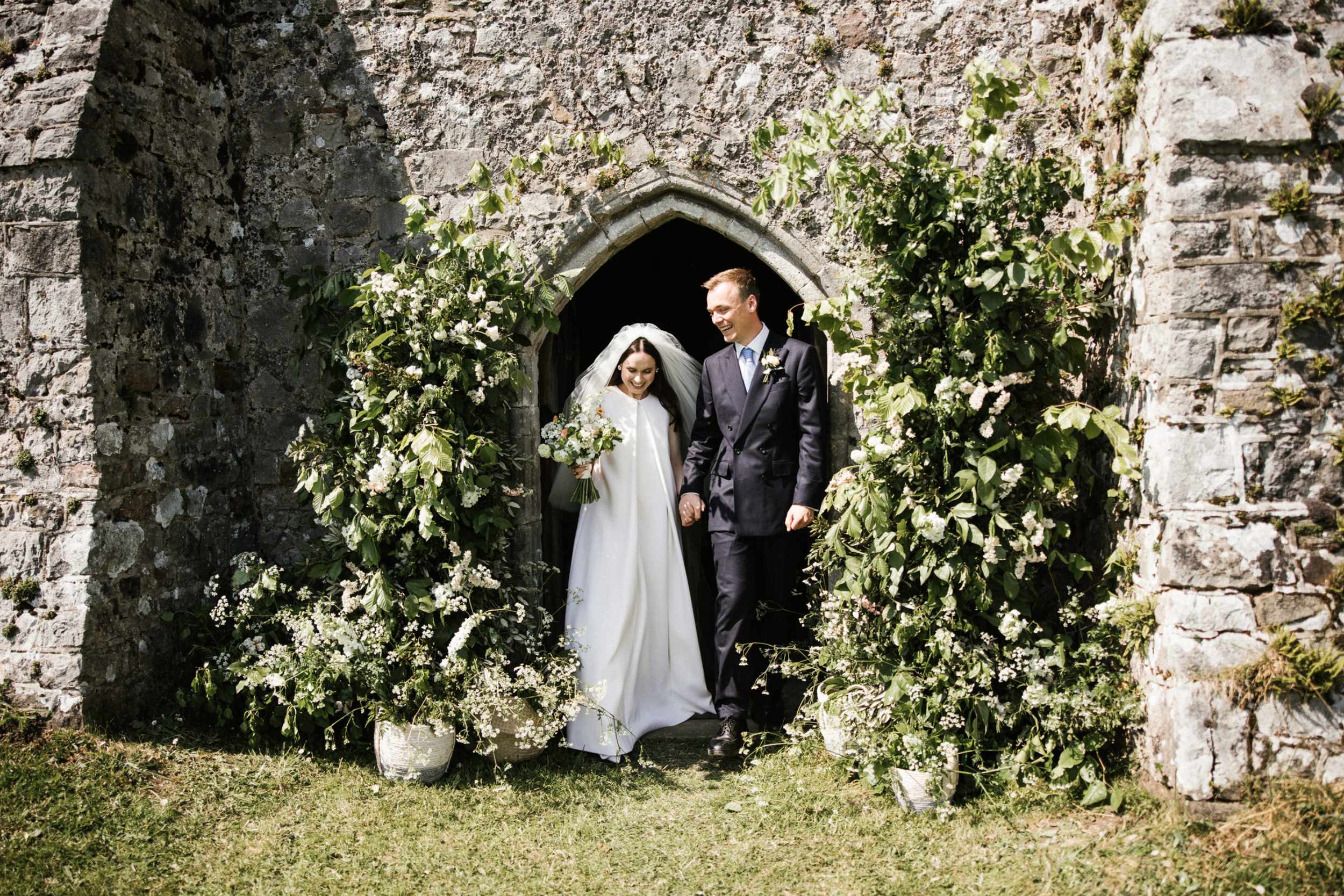 Flower arch outside Penrice estate church wedding, Gower
