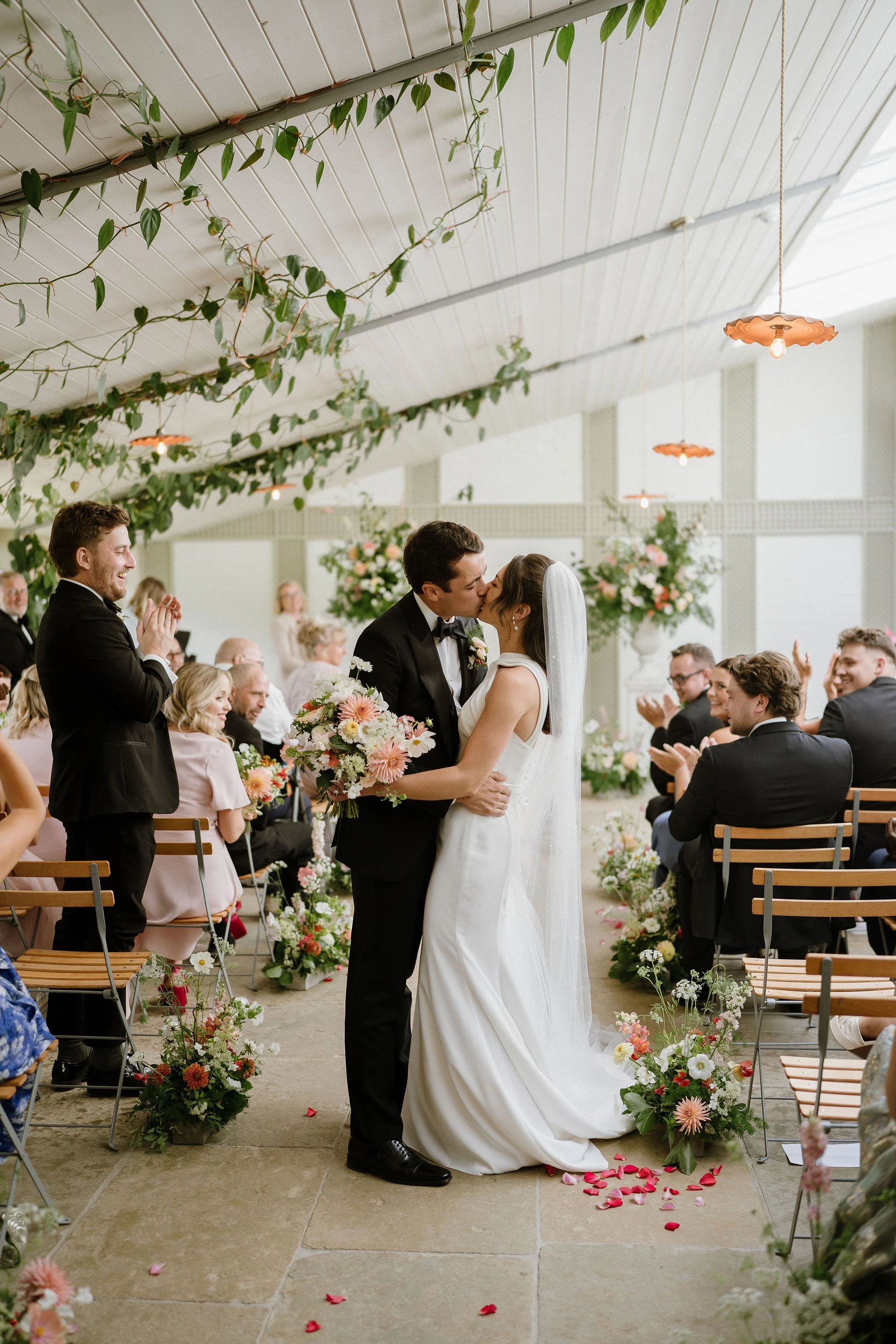 Bride and groom in wedding ceremony at Kin House, Wiltshire