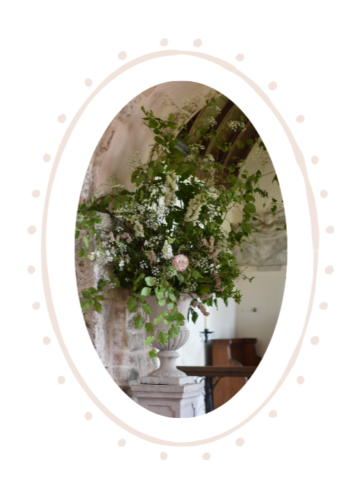 Flowers in an urn at Penrice Estate Church Wedding