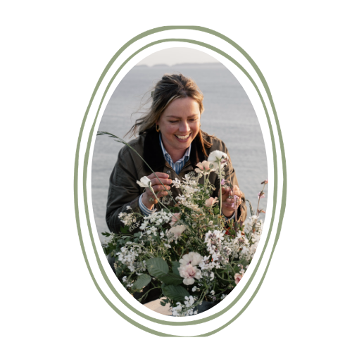 Florist arranging flowers by the sea