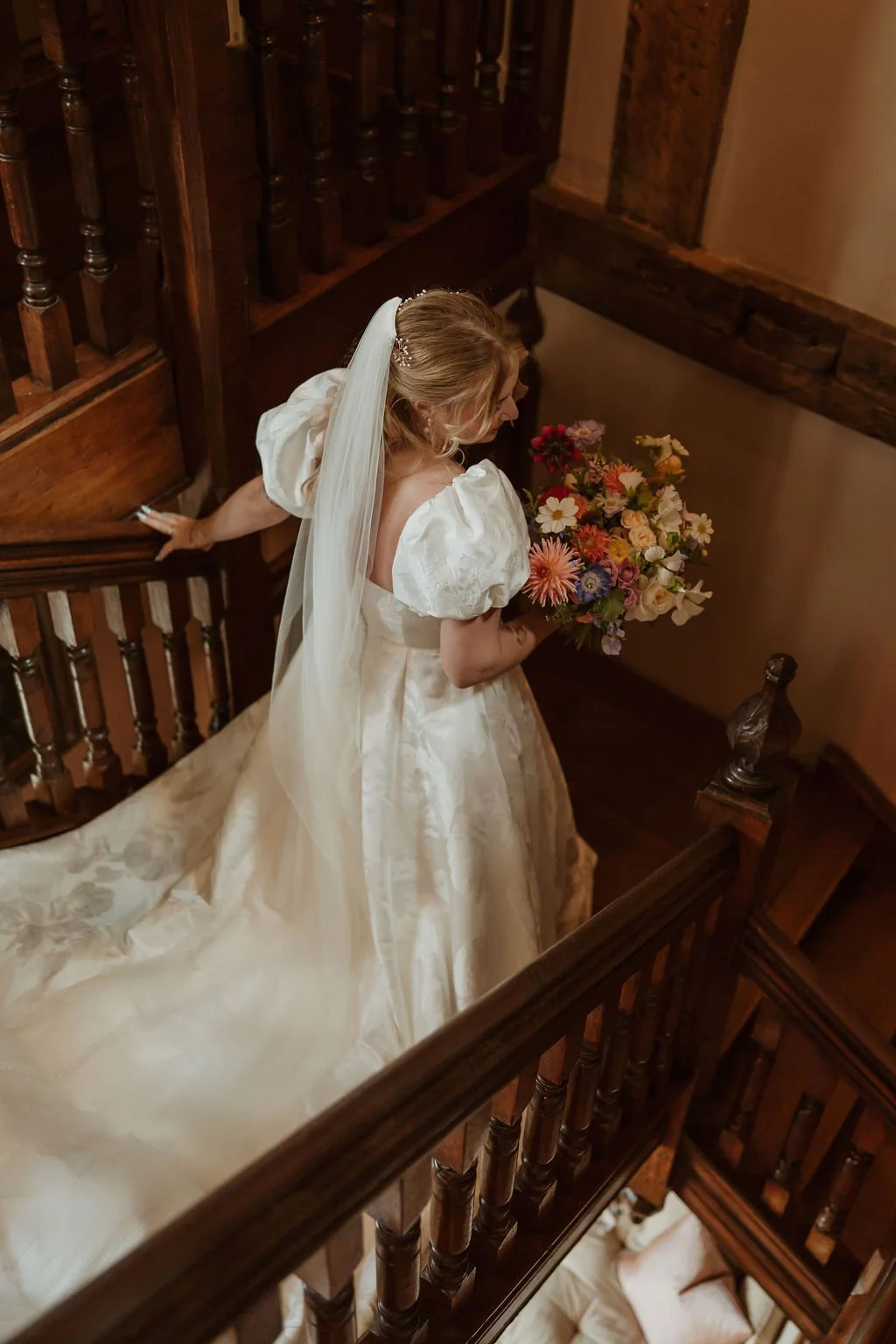 Bride holding flower bouquet at Dewsall Court wedding