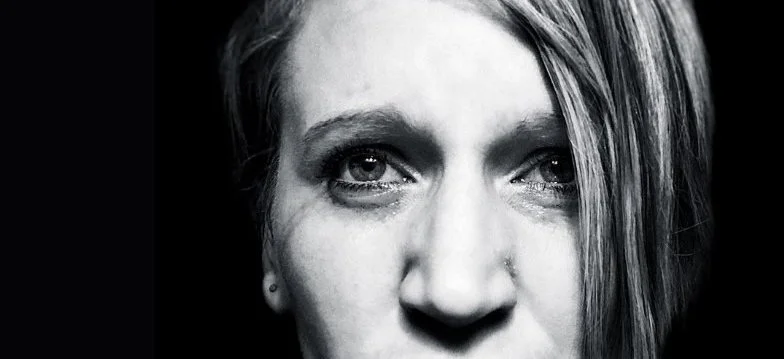 Featured image for an article about emotional healing on The Resilience Method©, showing a close-up portrait of Melissa Lynn Sharp with tears in her eyes.