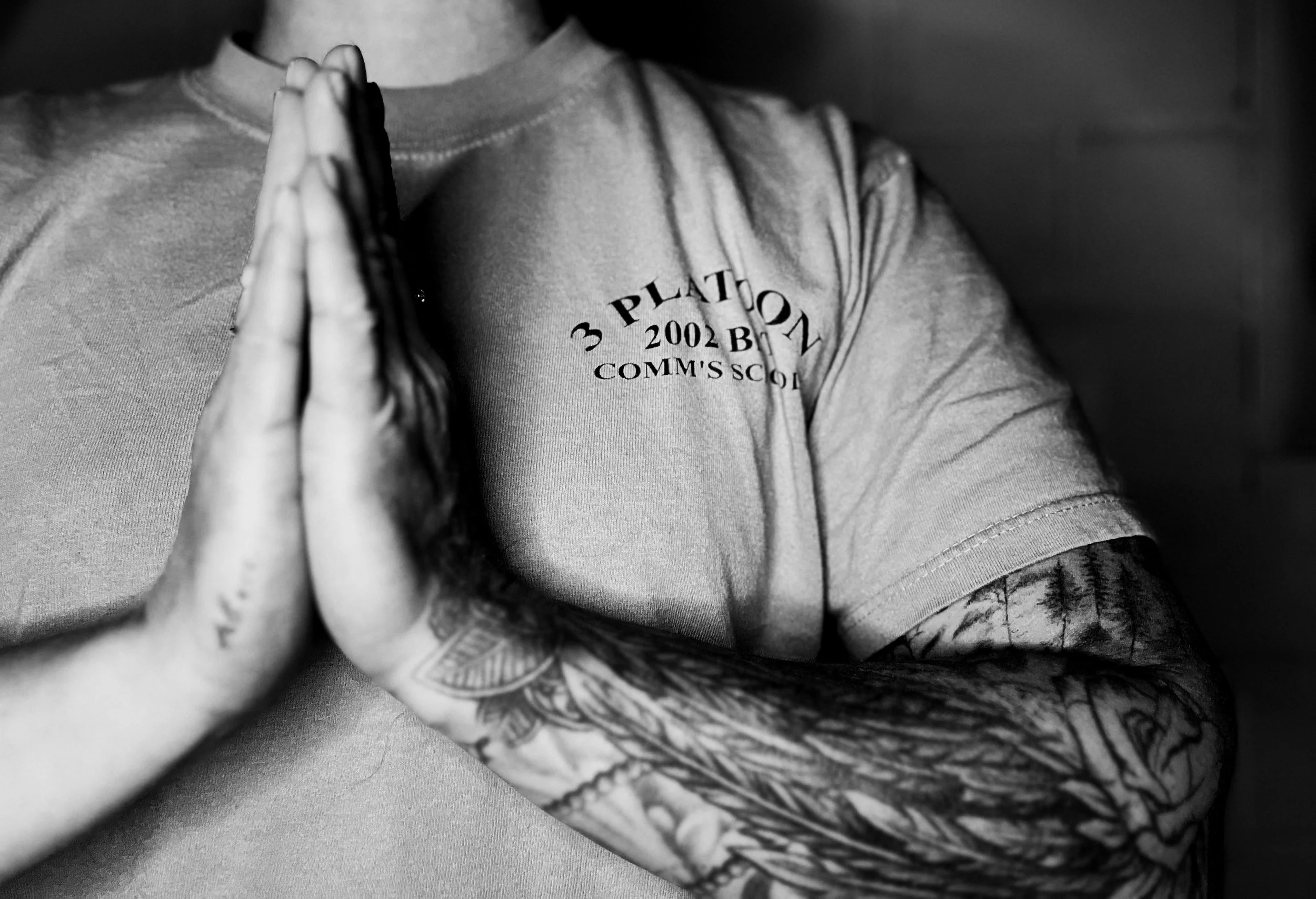 Black-and-white photograph of Melissa Lynn Sharp with hands together in reflection, representing emotional resilience, self-leadership, and personal growth.