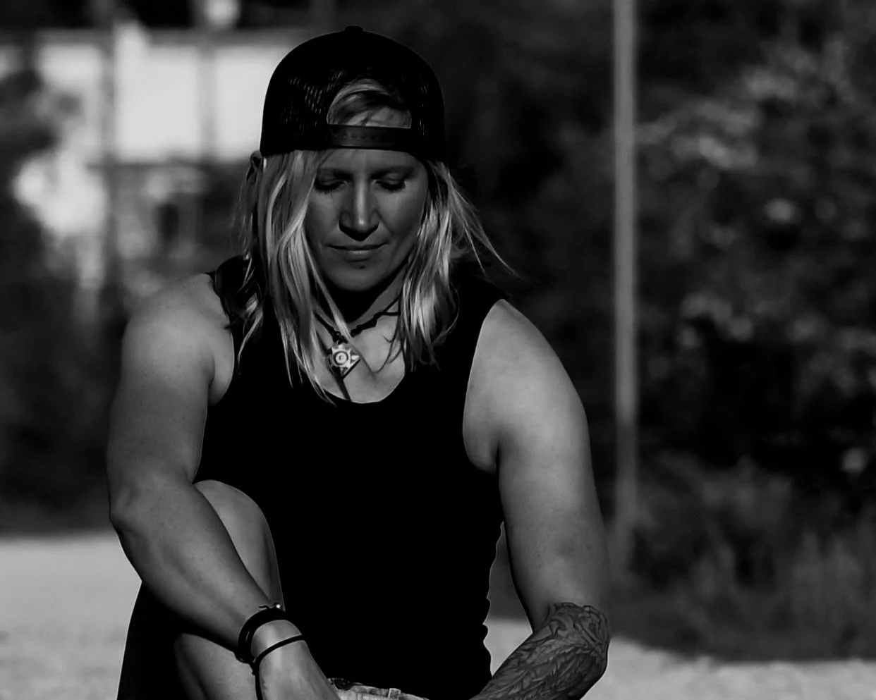 Featured image for an article about healing and personal transformation on The Resilience Method©, showing Melissa Lynn Sharp sitting outdoors in quiet reflection.