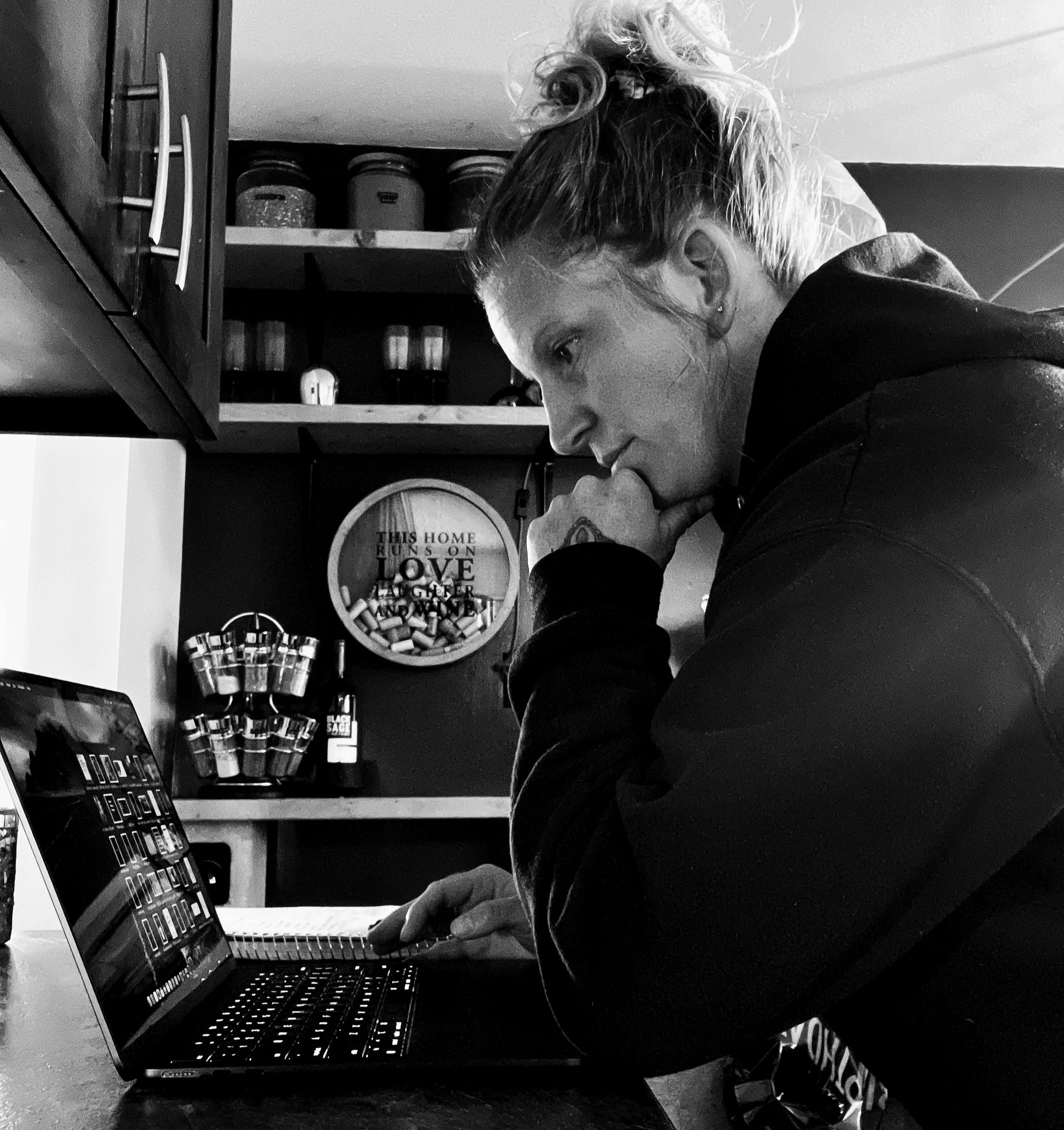 Melissa Lynn Sharp working on her laptop.