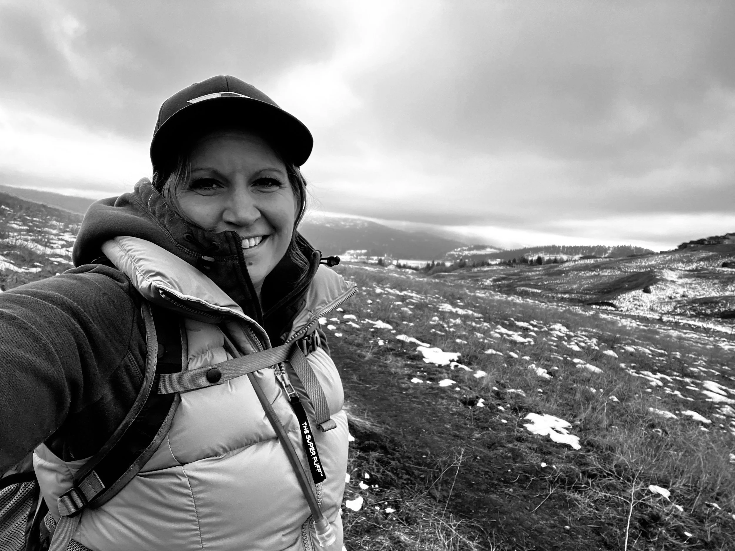 Melissa Lynn Sharp taking a selfie while hiking, representing personal growth, resilience, and embracing life's transitions.