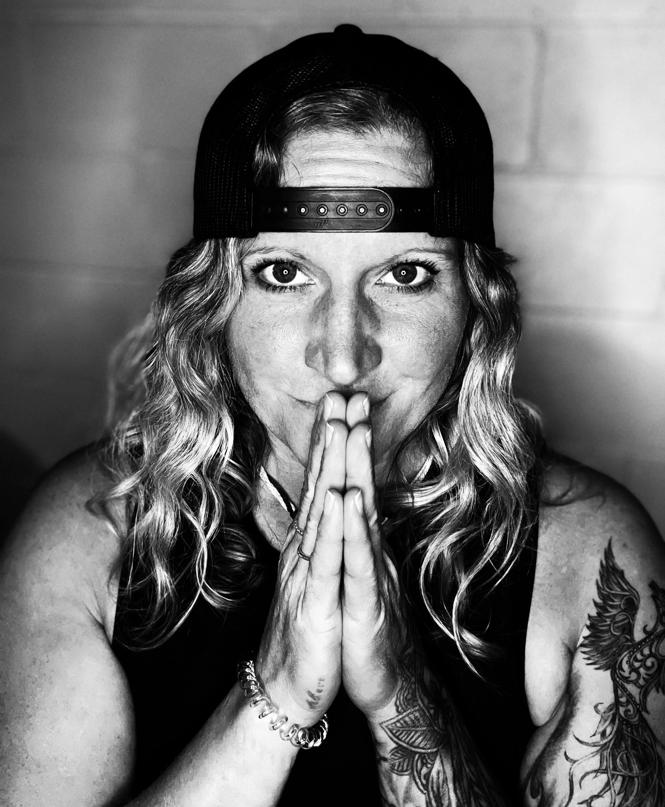 Author Melissa Lynn Sharp with hands in prayer, representing hope, resilience, and healing through adversity.